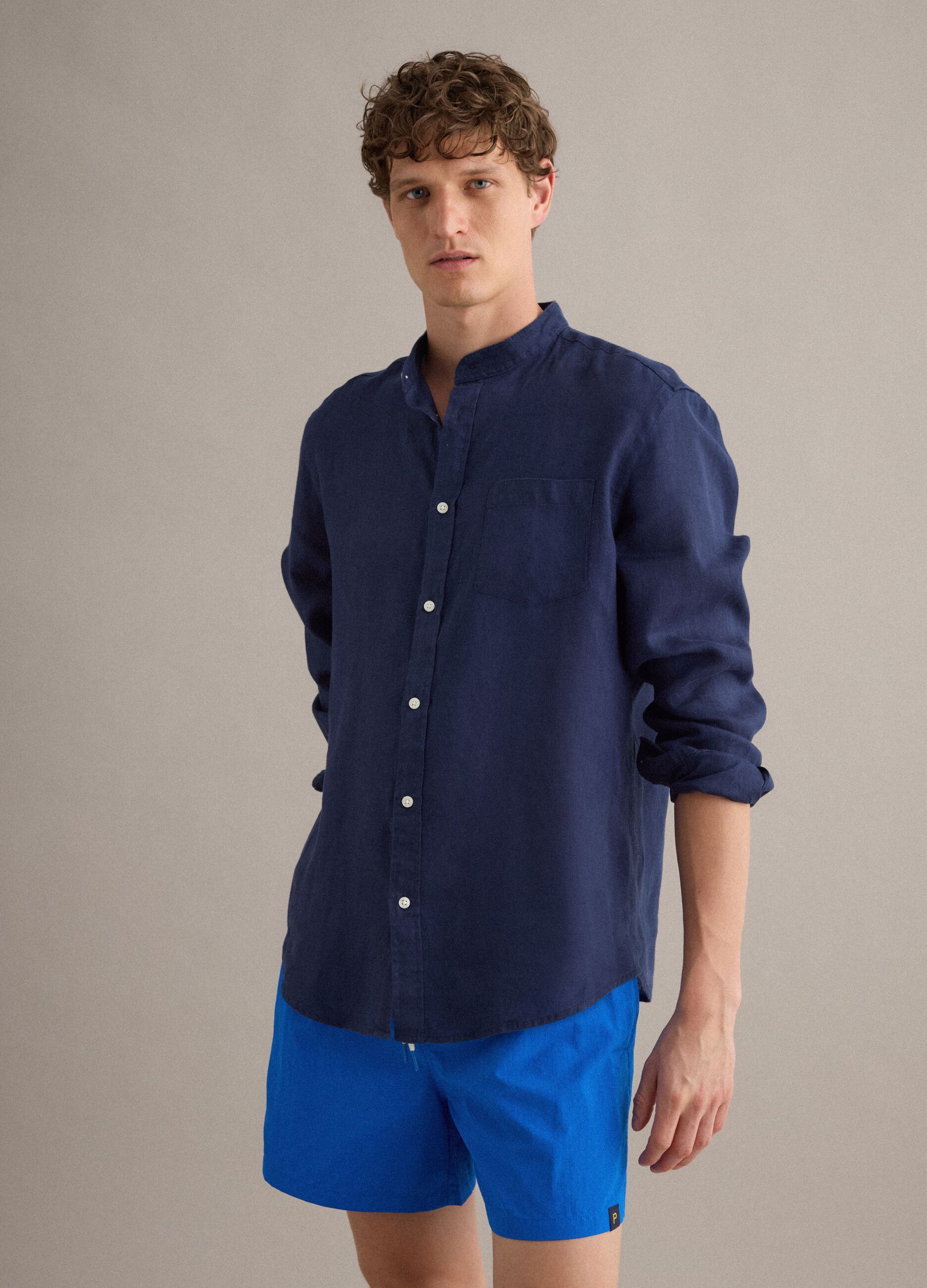 Blue swim shorts with elasticated waist and drawstring
