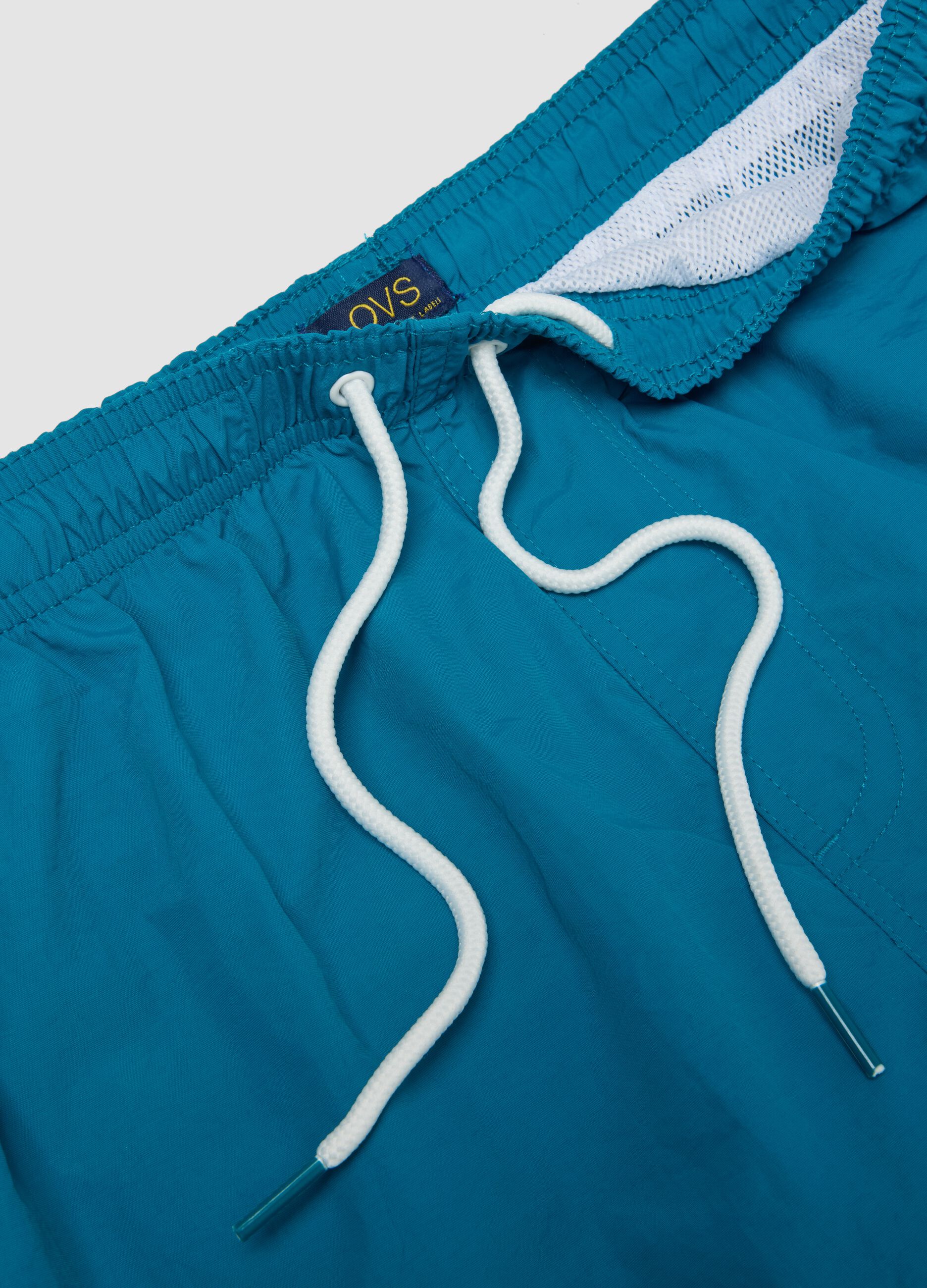 Blue swim shorts with elasticated waist