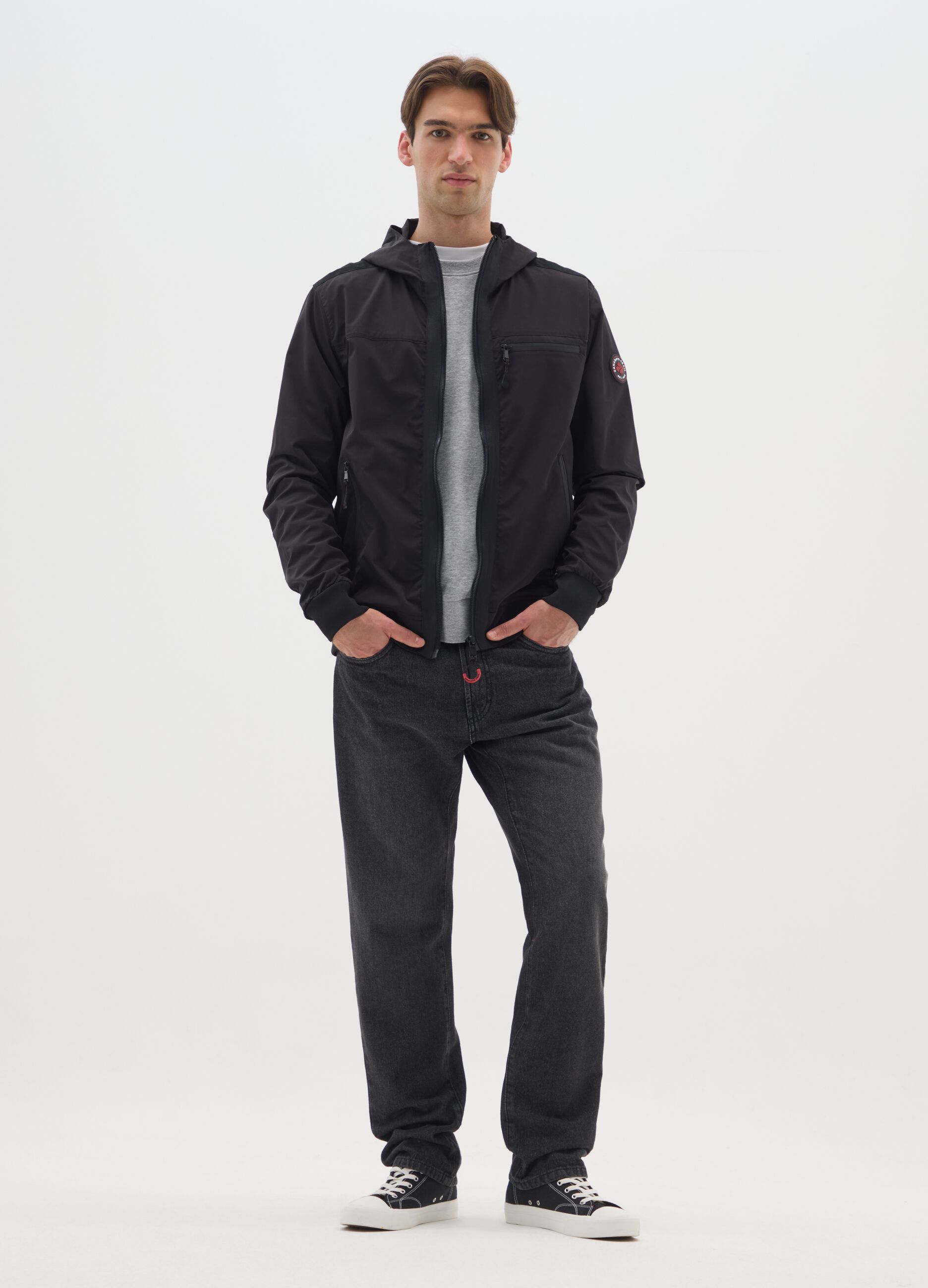 Black jacket in heavy fabric with hood and zip