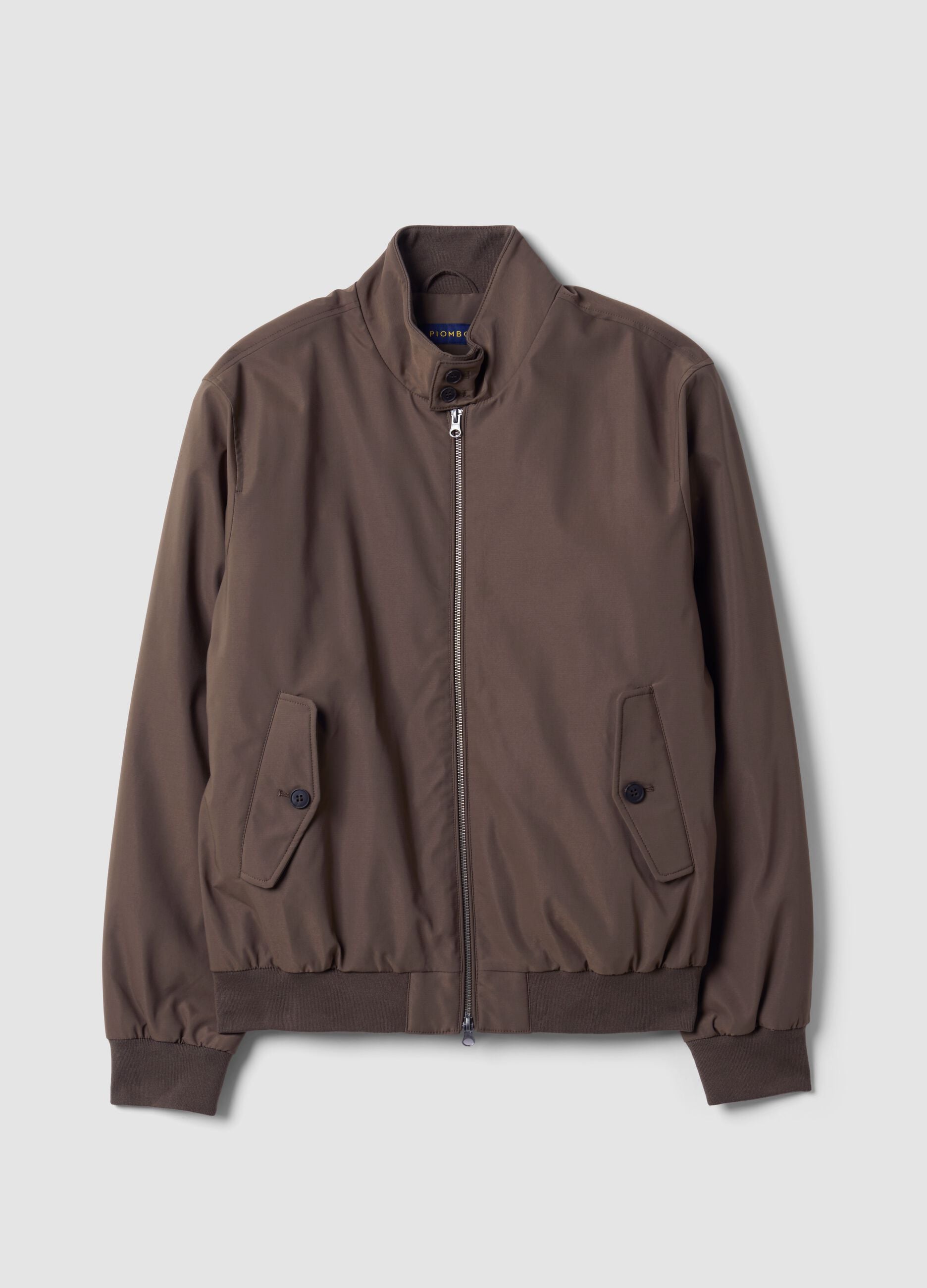 Green padded jacket in a regular fit with zip and high collar