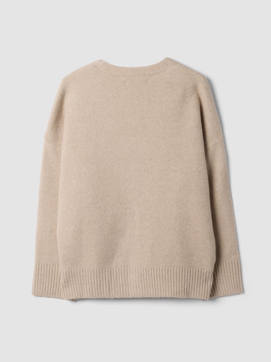 Cardigan beige in lana elasticizzata con scollo profondo a V_1