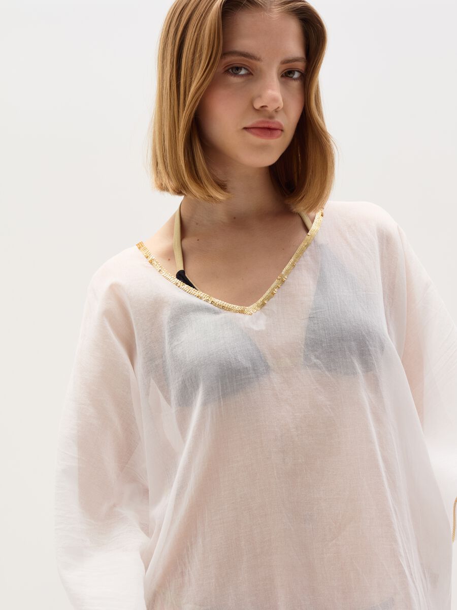 Beach cover-up poncho with lurex edging_1