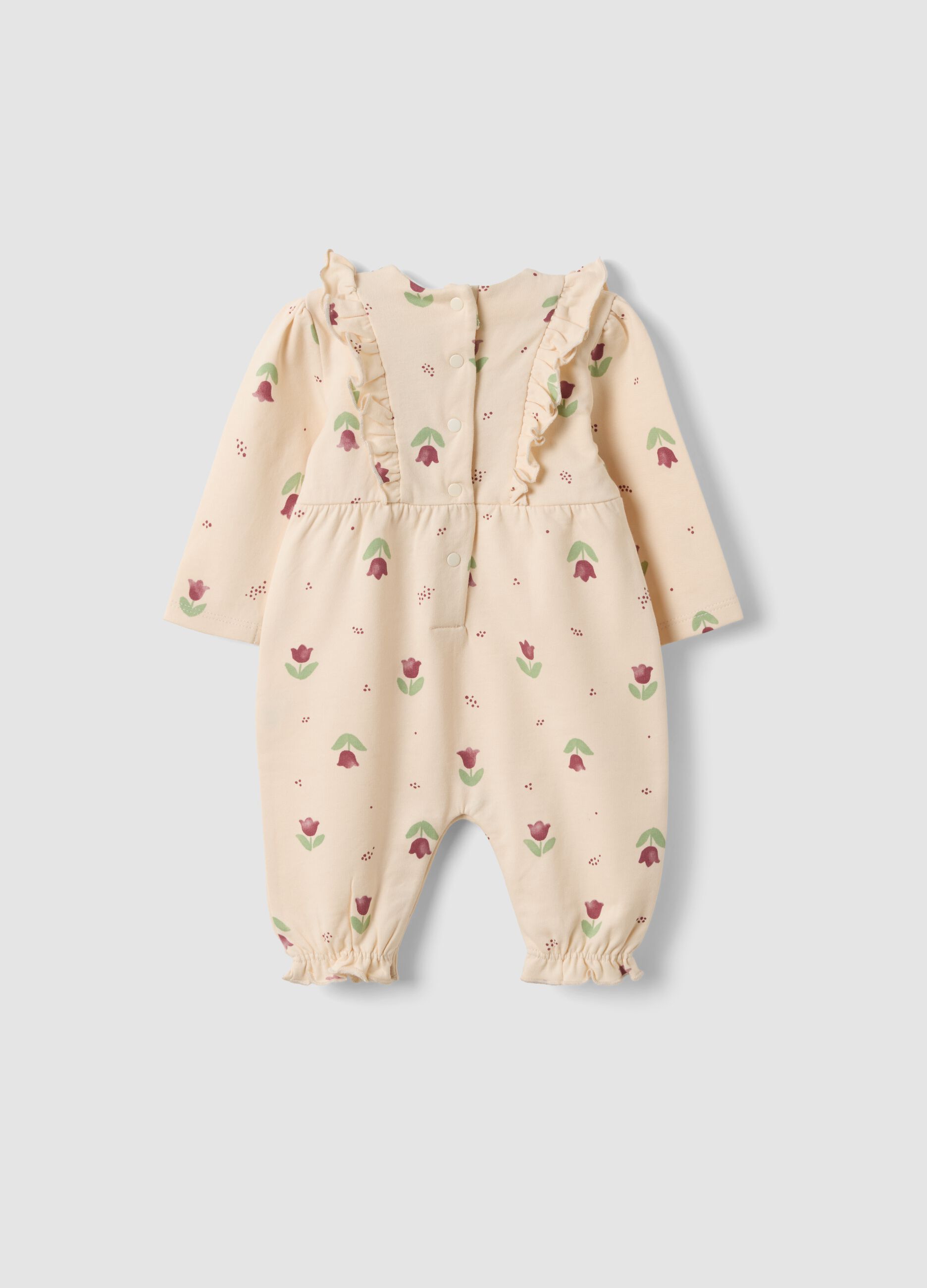 Tutina beige in puro cotone organico con stampa floreale per neonata