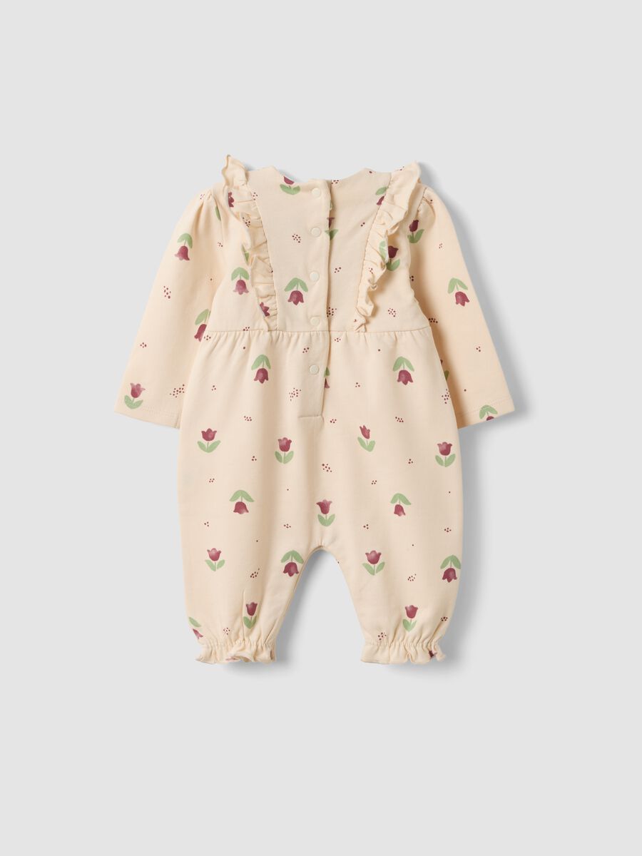 Tutina beige in puro cotone organico con stampa floreale per neonata_1