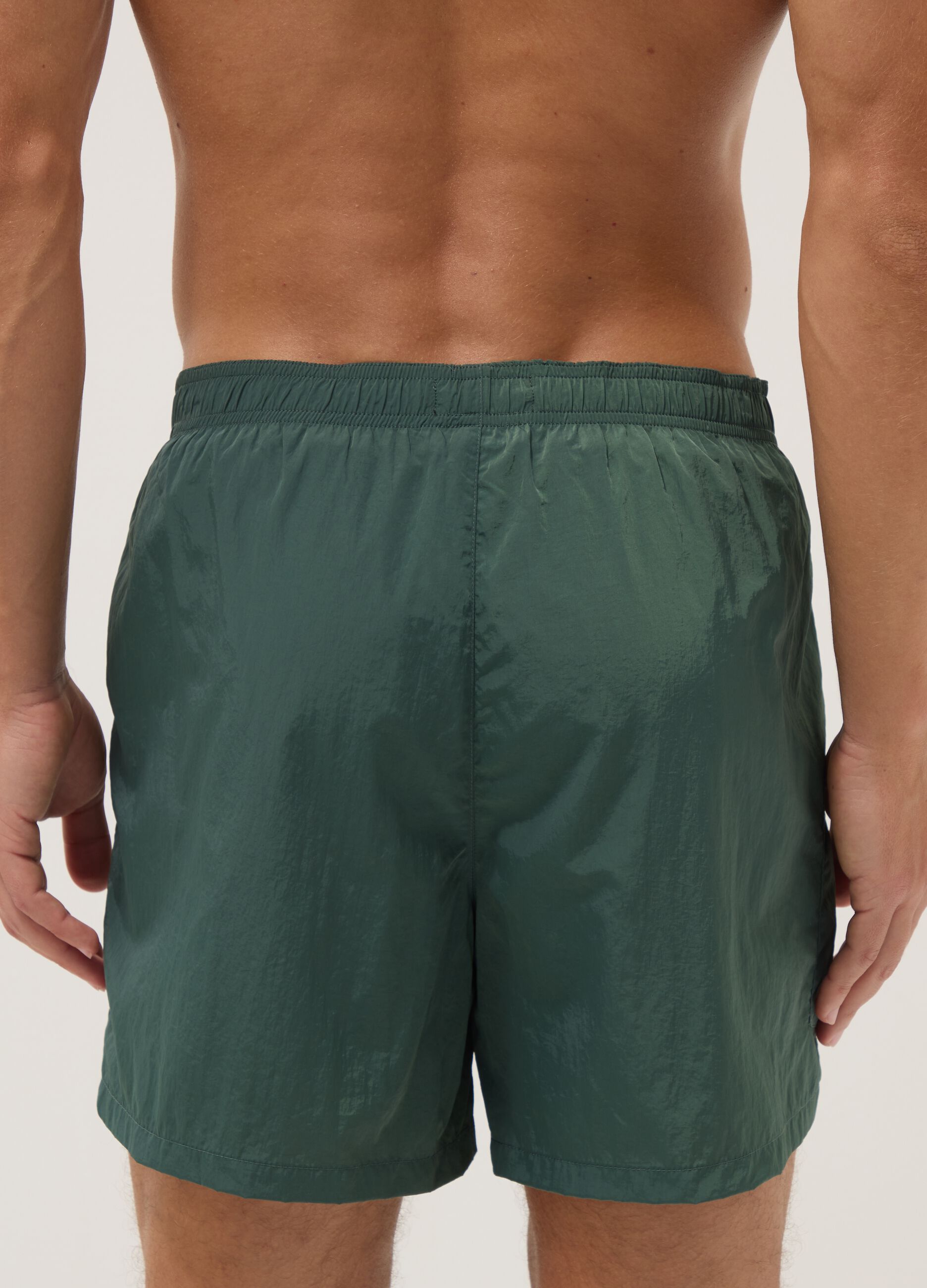 Green swim shorts with elasticated waistband