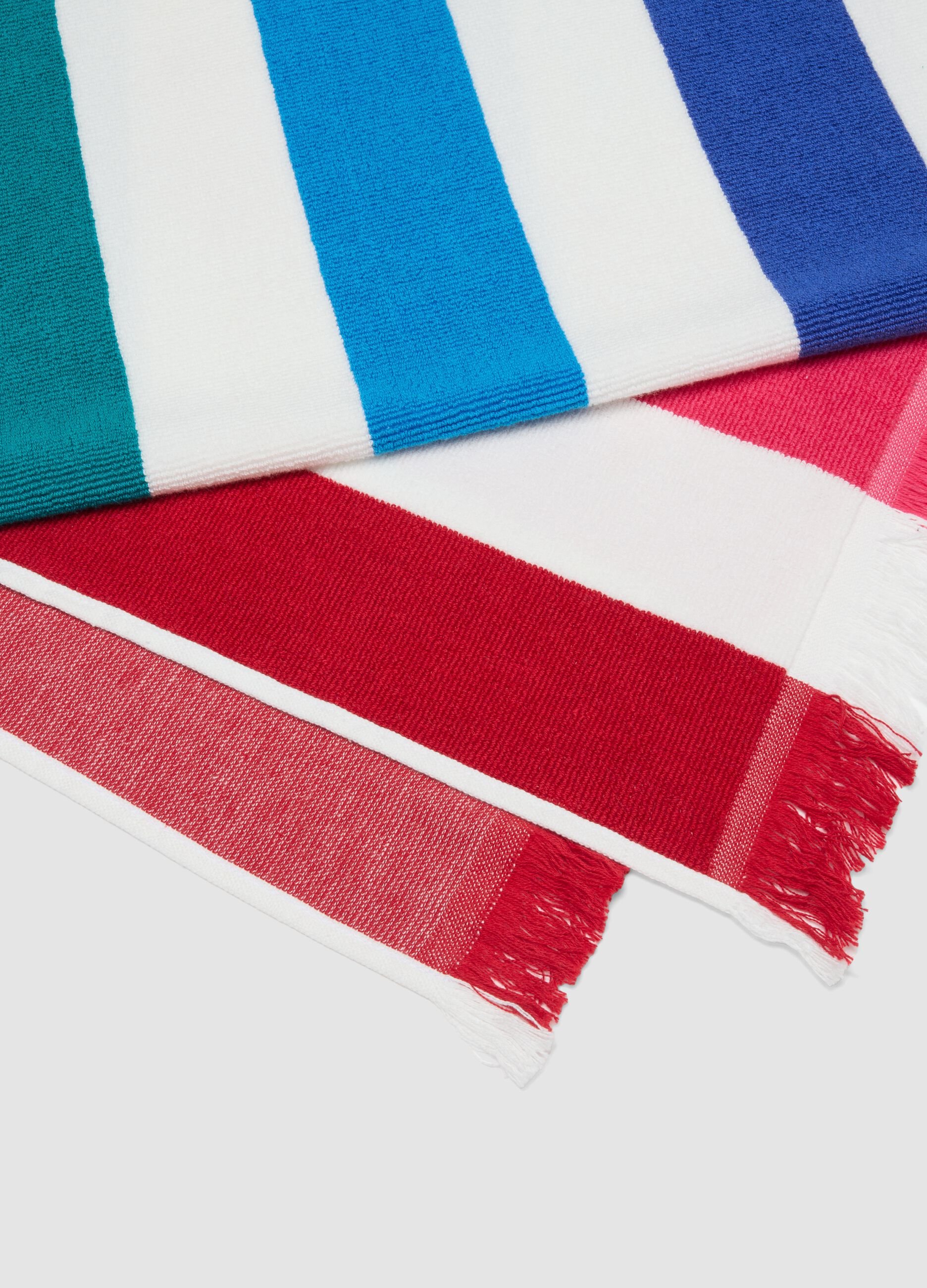 Telo mare multicolor in puro cotone a righe e con frange