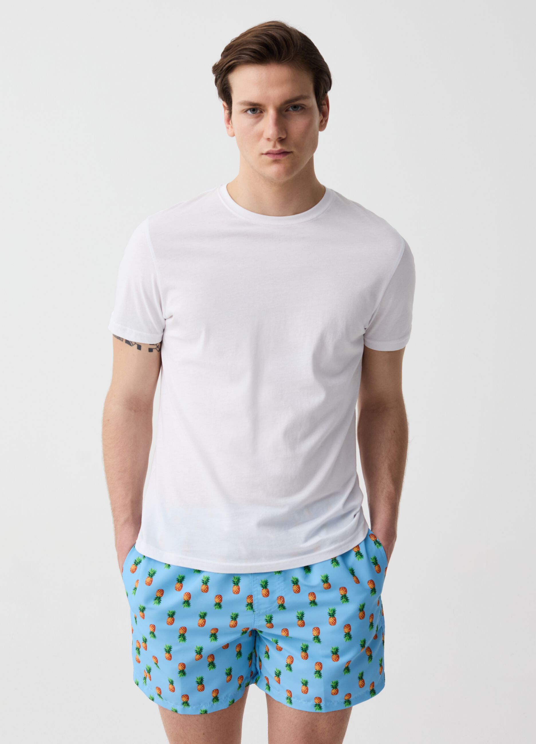 Swimming trunks with mini pineapples print