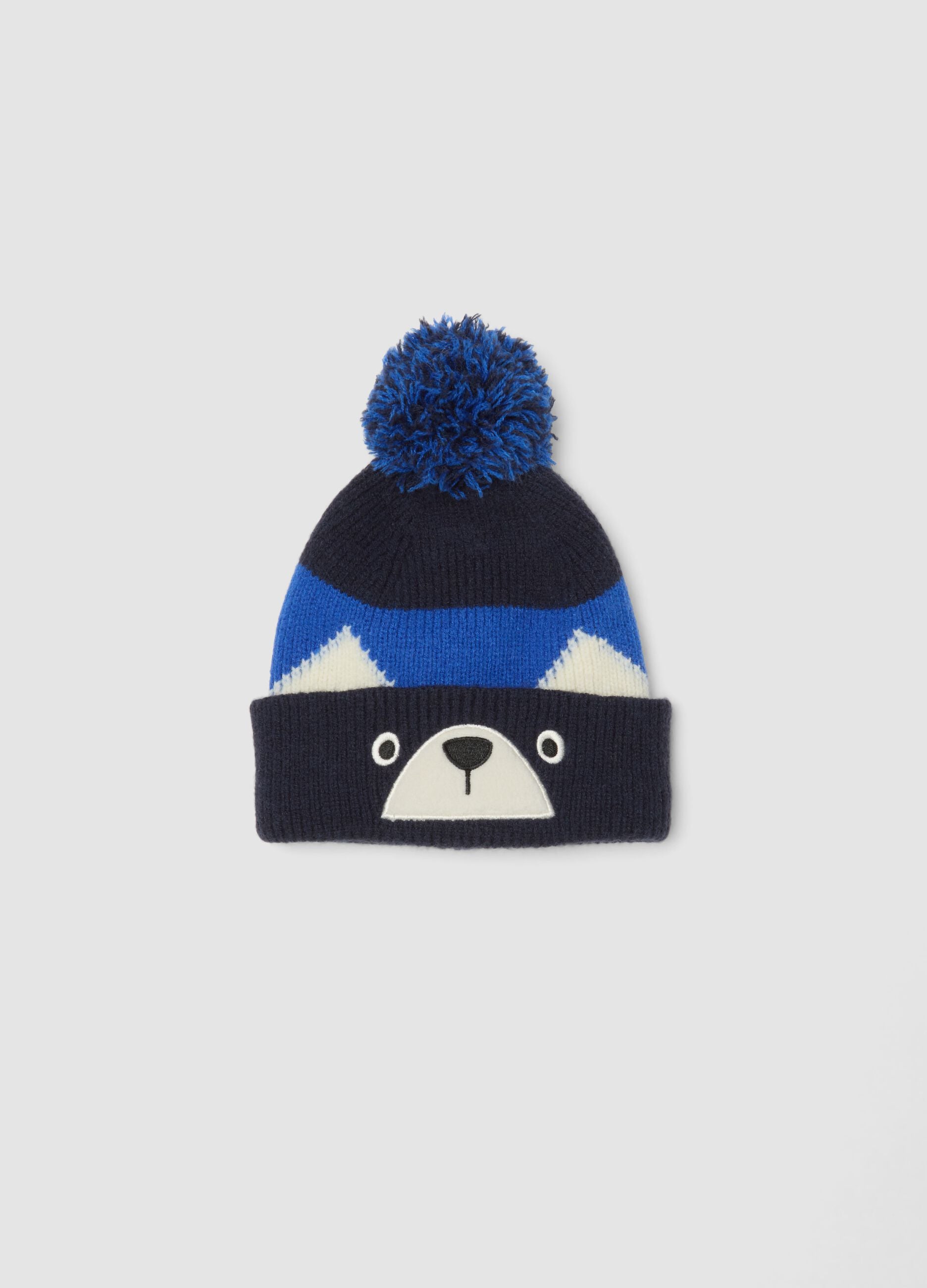 Gorro azul de malha com pompom e motivo animal