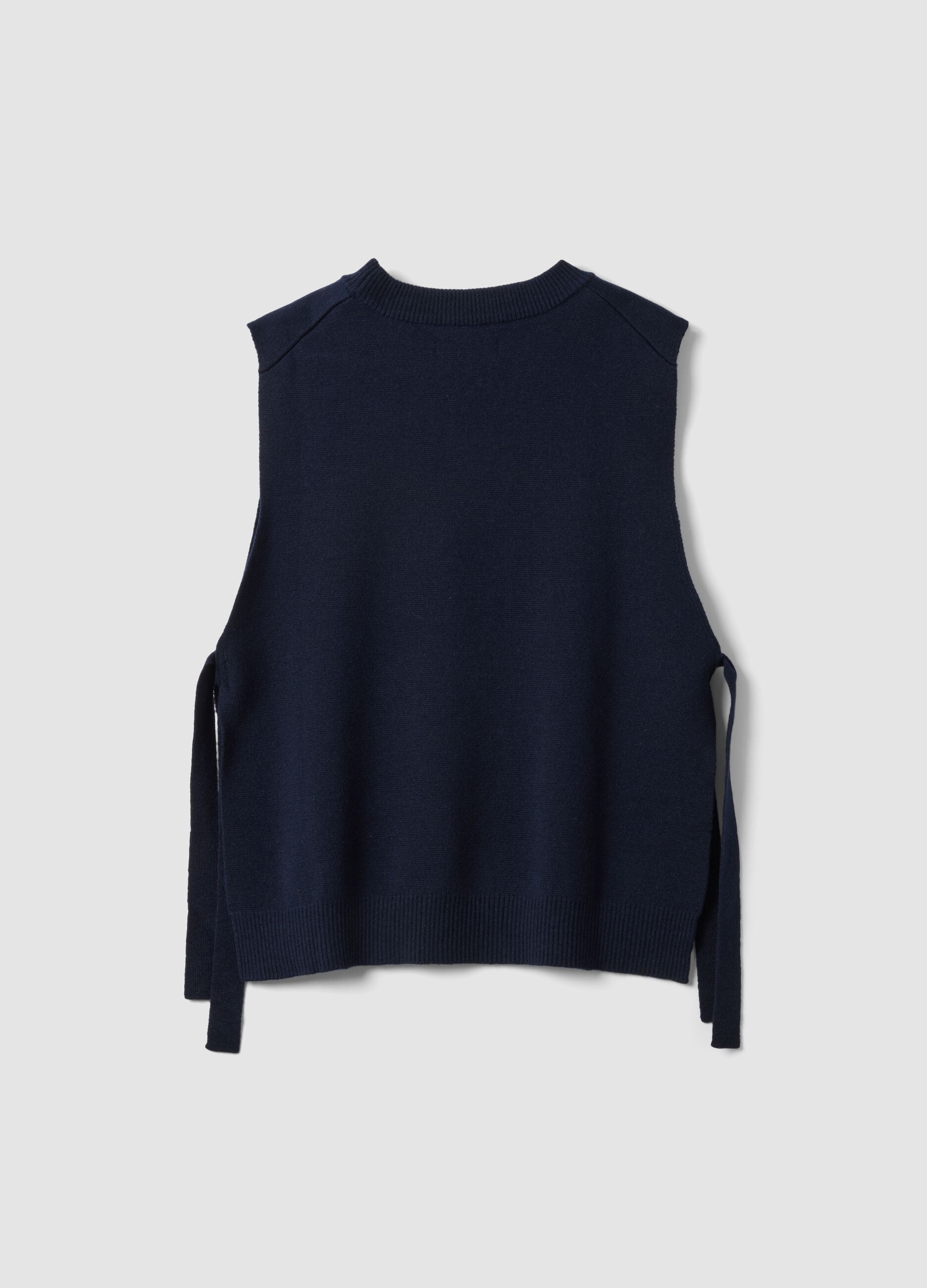 Chaleco azul de mezcla de lana con cuello redondo y lazadas laterales, corte regular