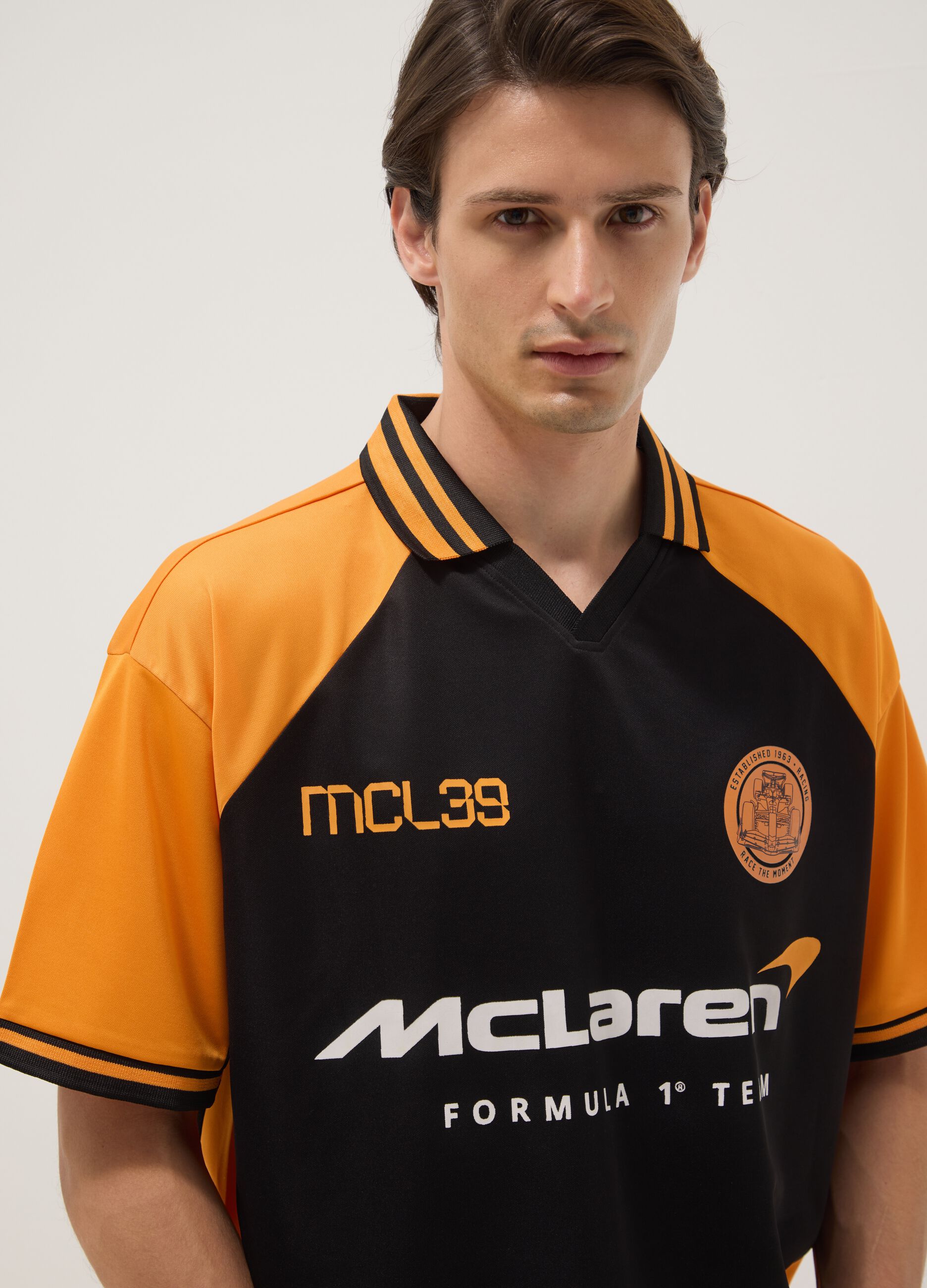 Black and orange oversized McLaren logo polo shirt