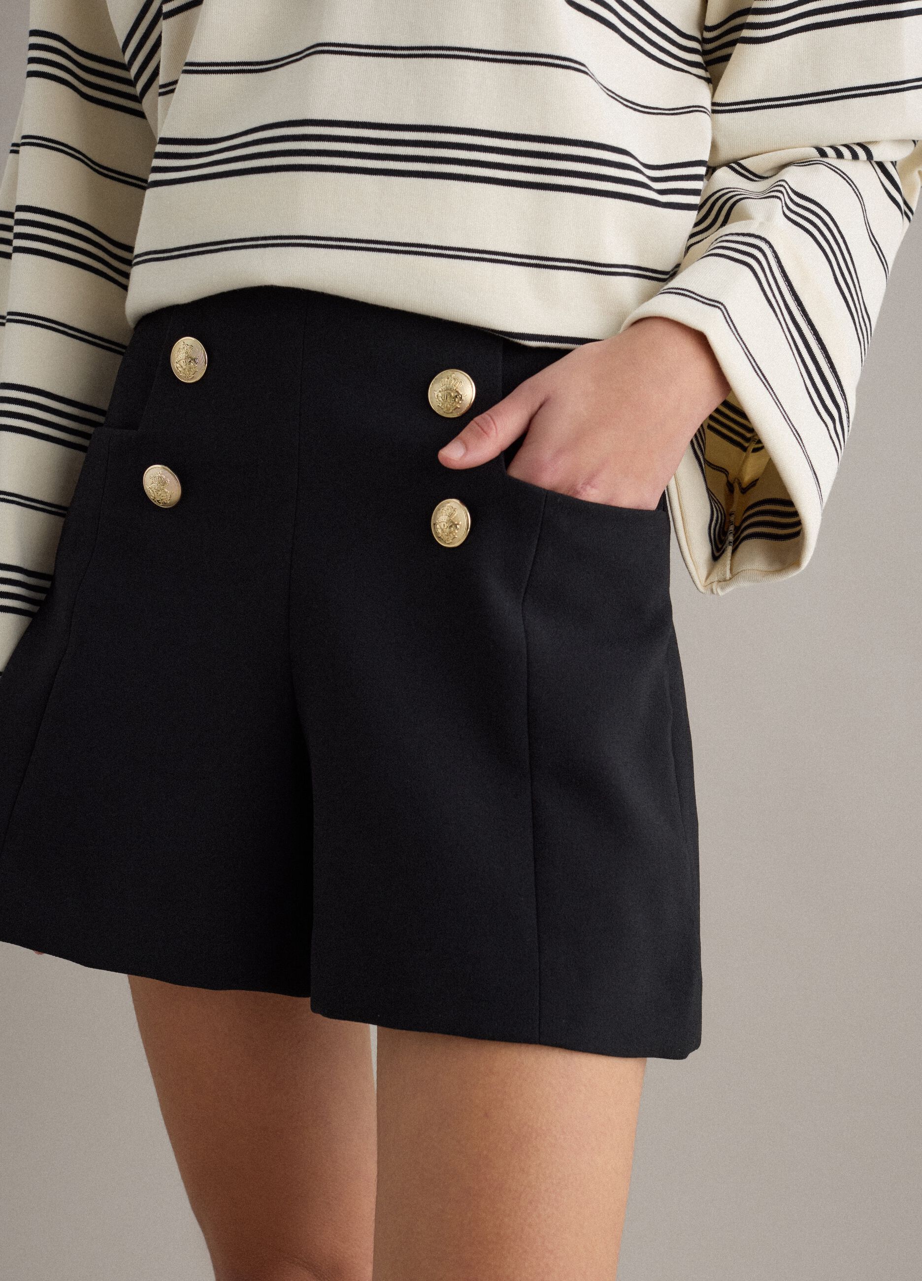 Black regular fit shorts with high waist and gold buttons