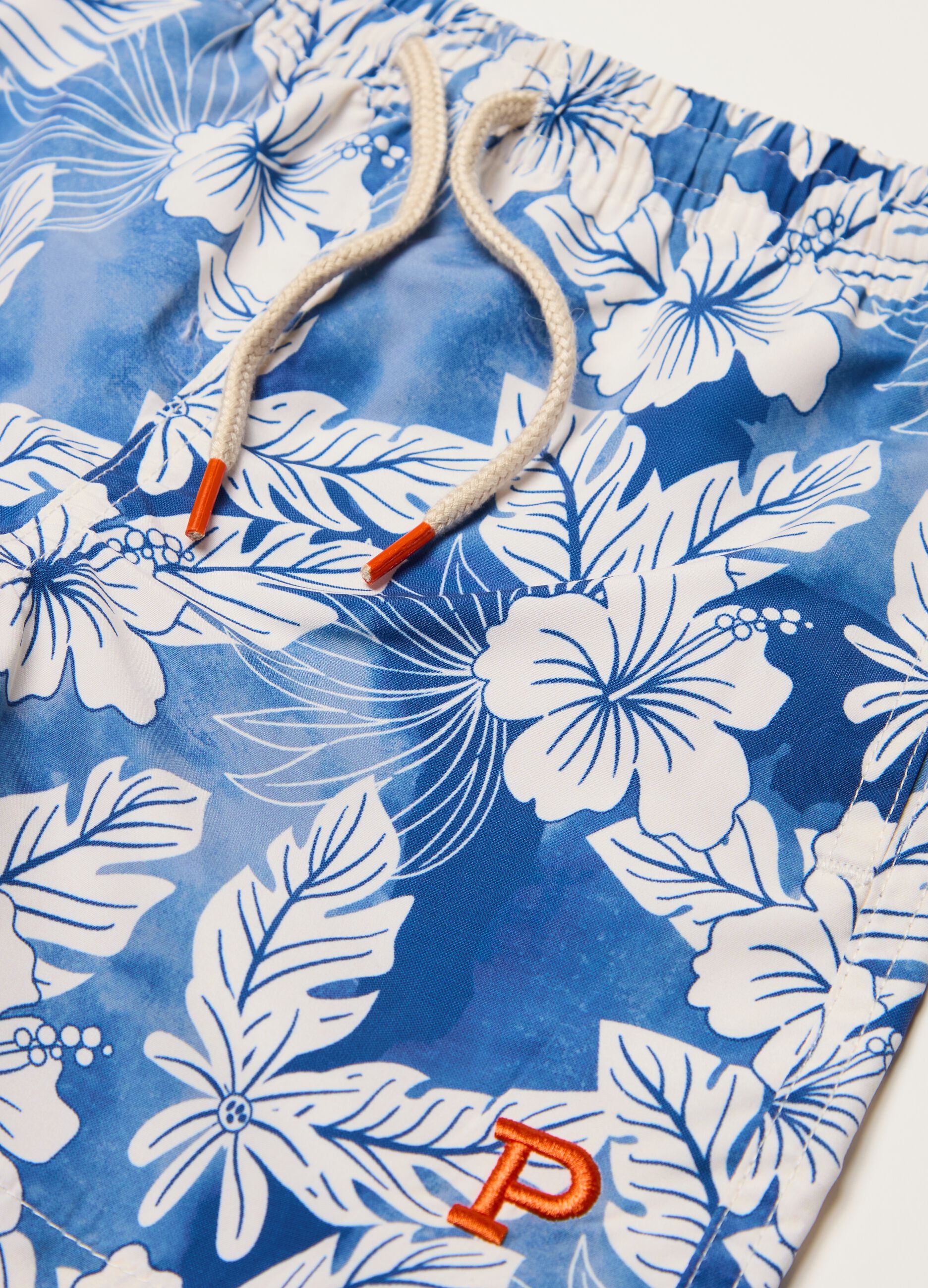 Swimming trunks with drawstring and tropical print