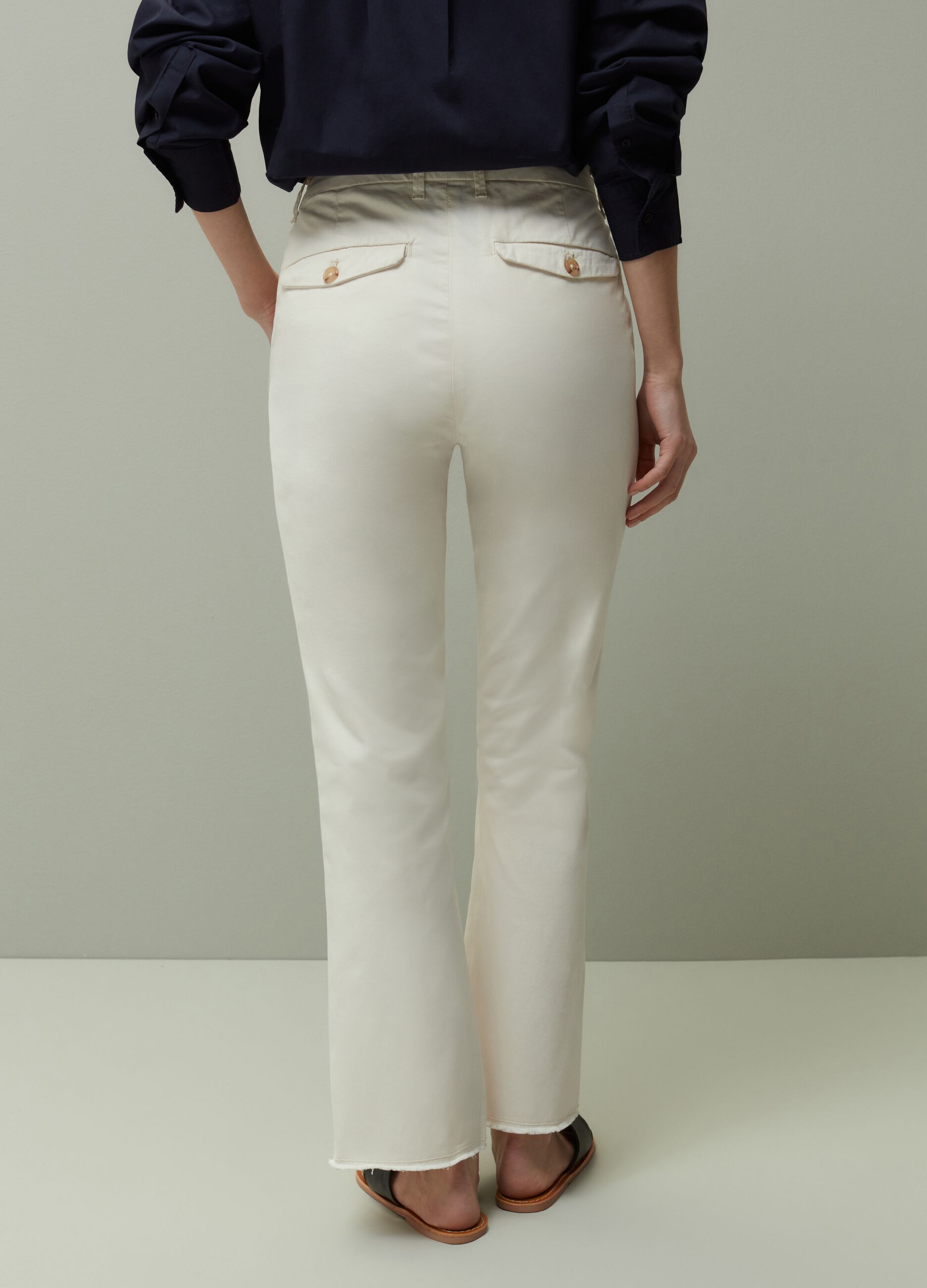 Flared trousers with raw hems