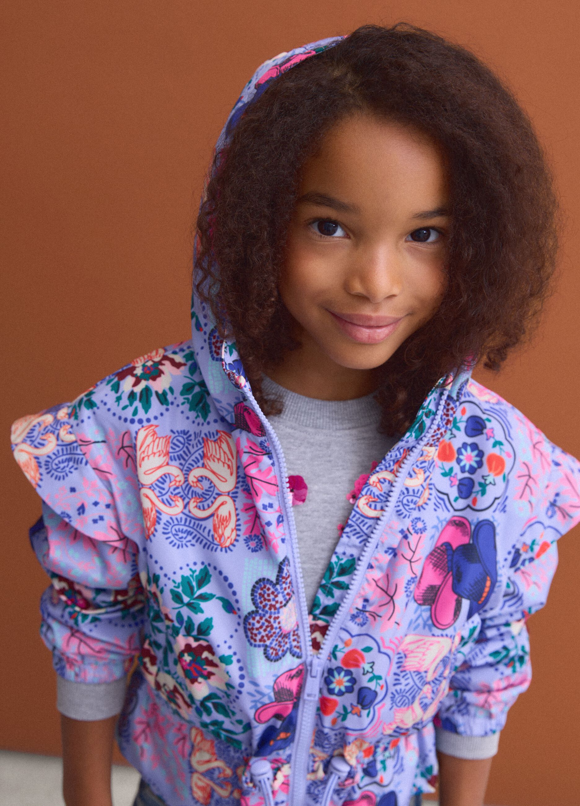 Girls&rsquo; multicolour hooded rain jacket with all-over print