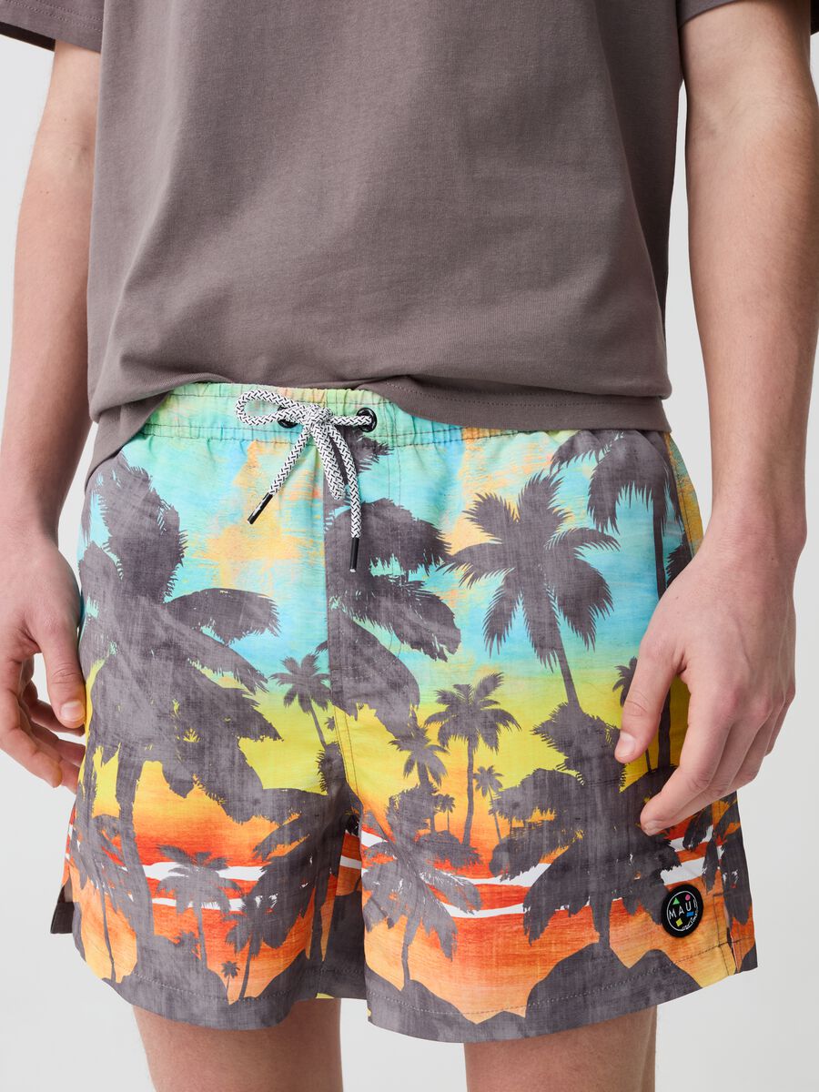 Swimming trunks with tropical print_1