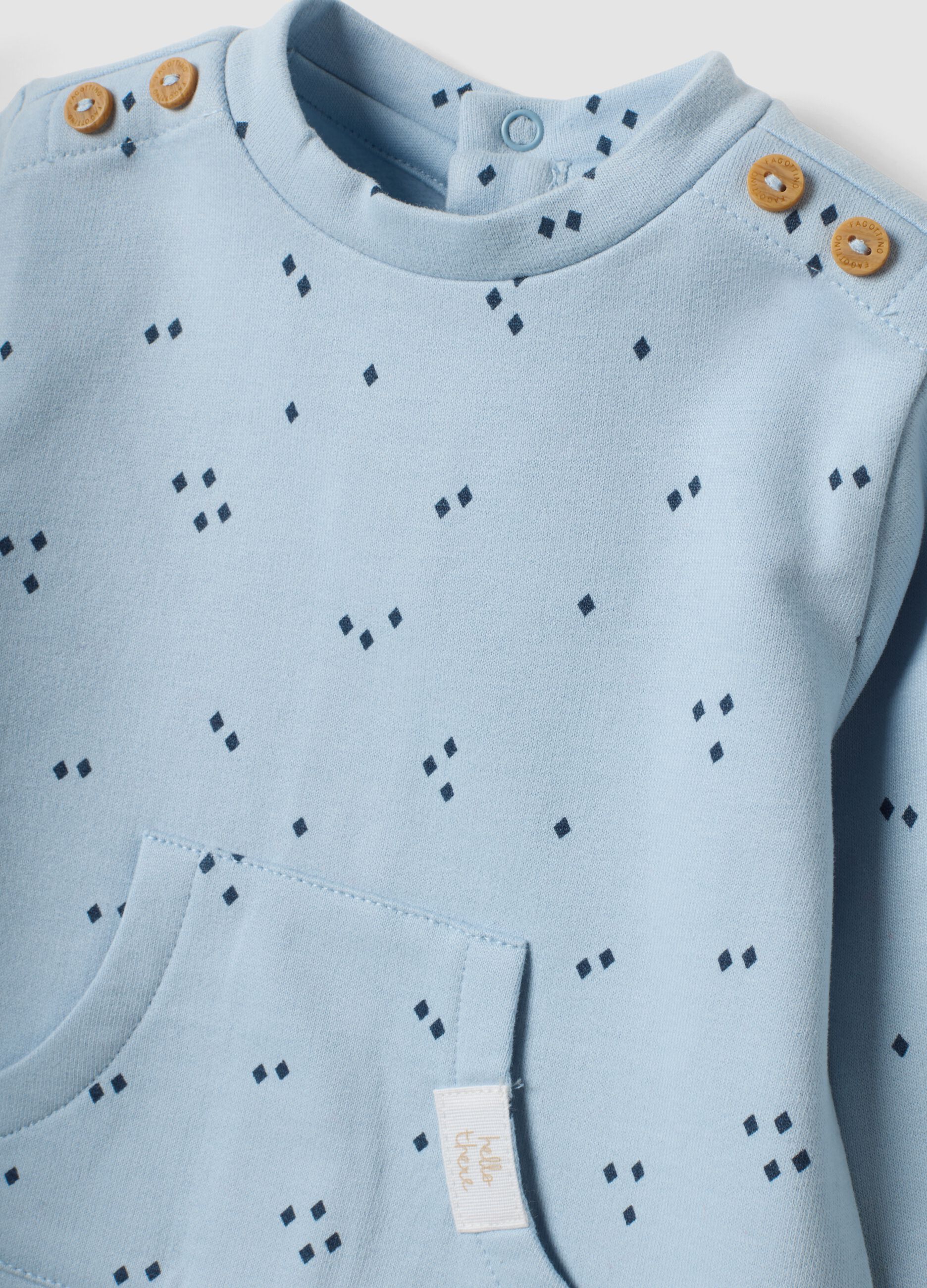Tutina azzurra in puro cotone organico con stampa all over