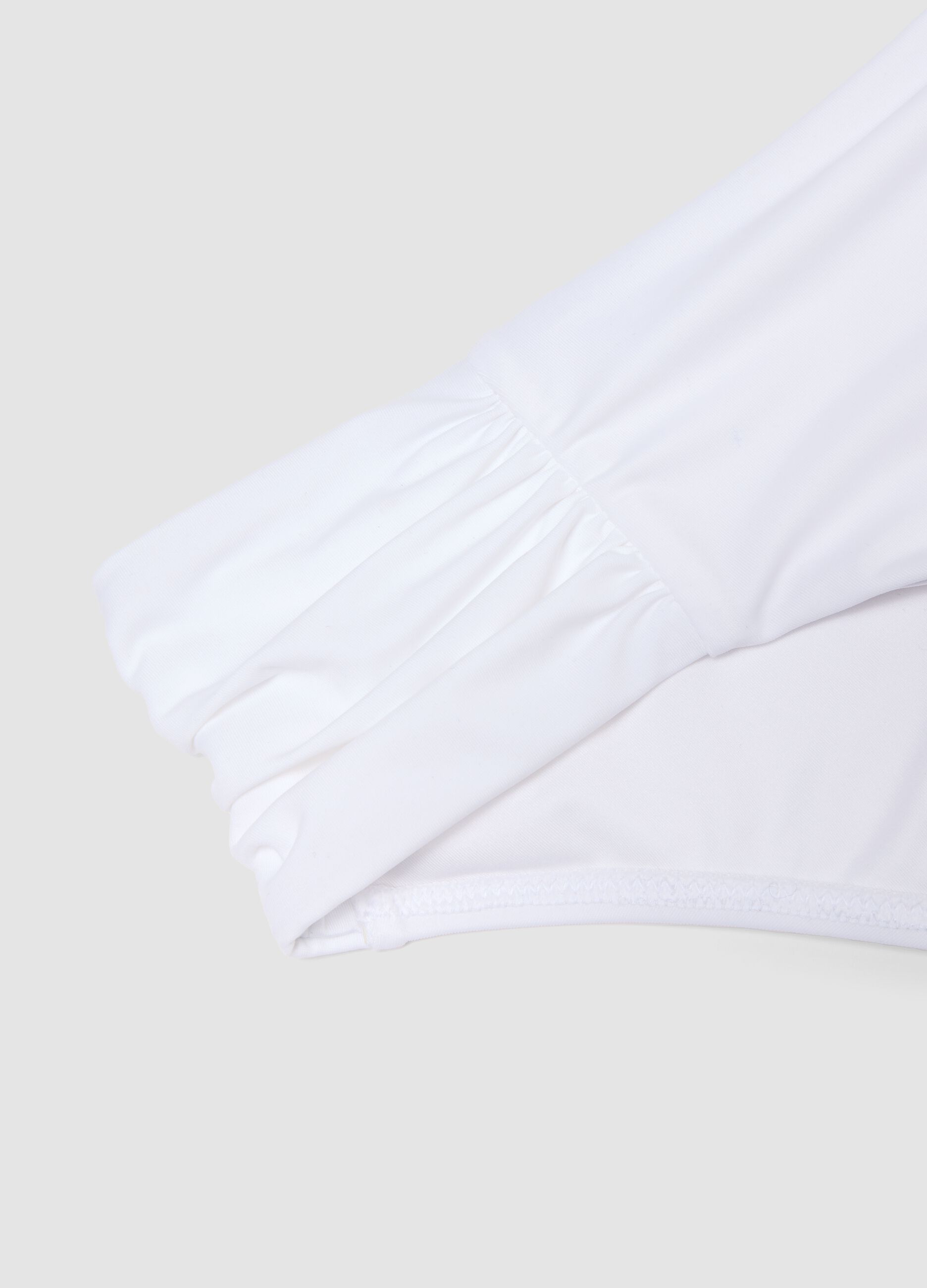 White stretch bikini bottoms with ruched details, regular fit