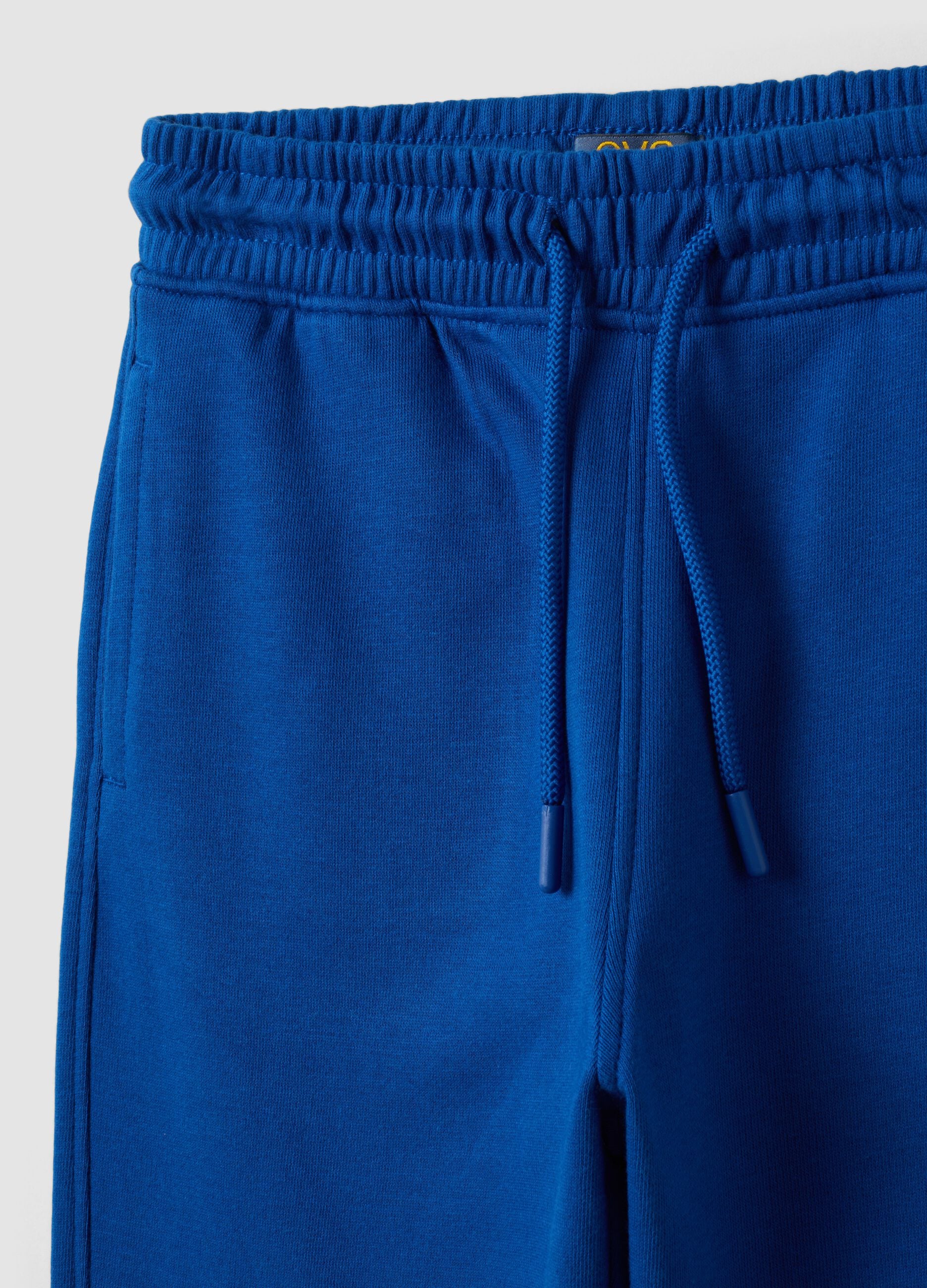 Blue cotton and viscose blend joggers with contrast print for boys