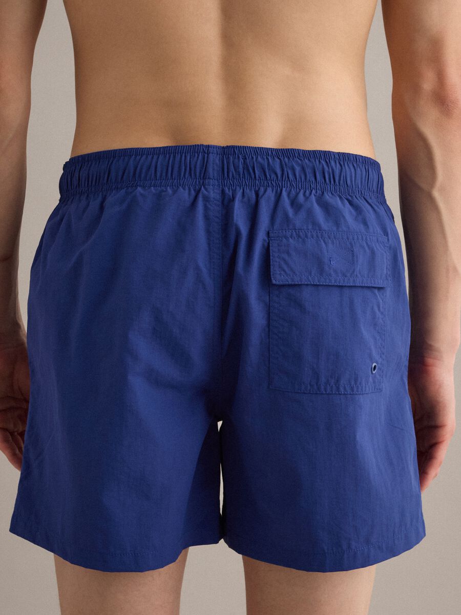 Blue swim shorts with elasticated waist and drawstring_4
