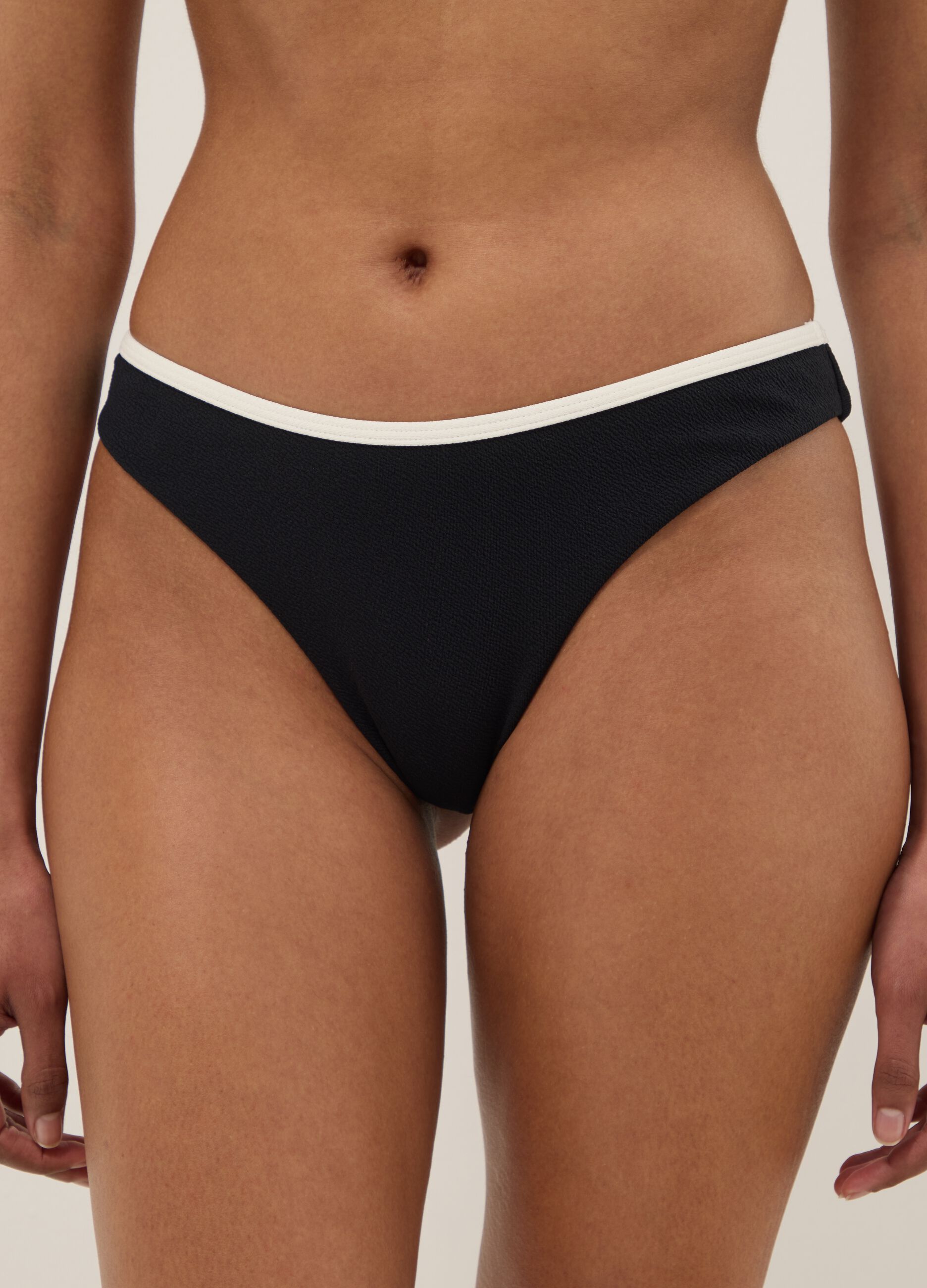 Black stretch swim briefs with white trim