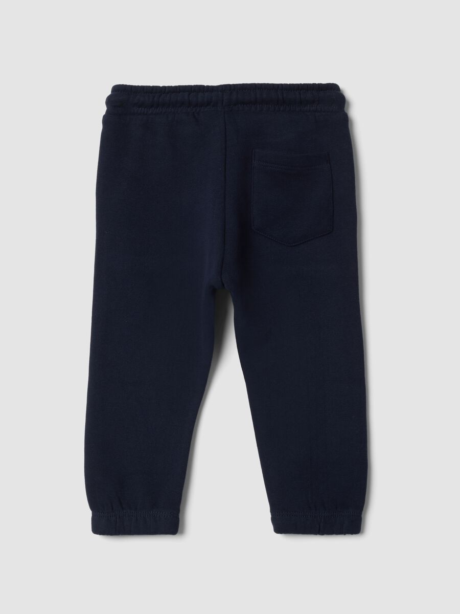 Pantaloni jogger blu in puro cotone con motivo animalier_1