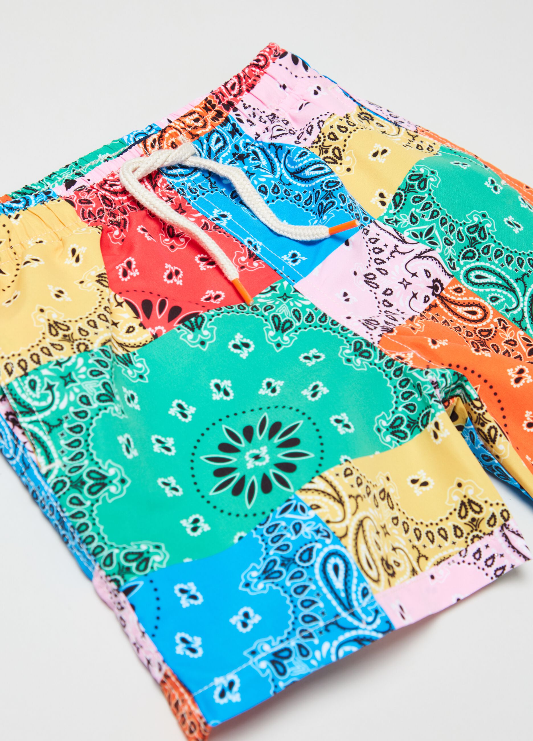 Swimming trunks with paisley print
