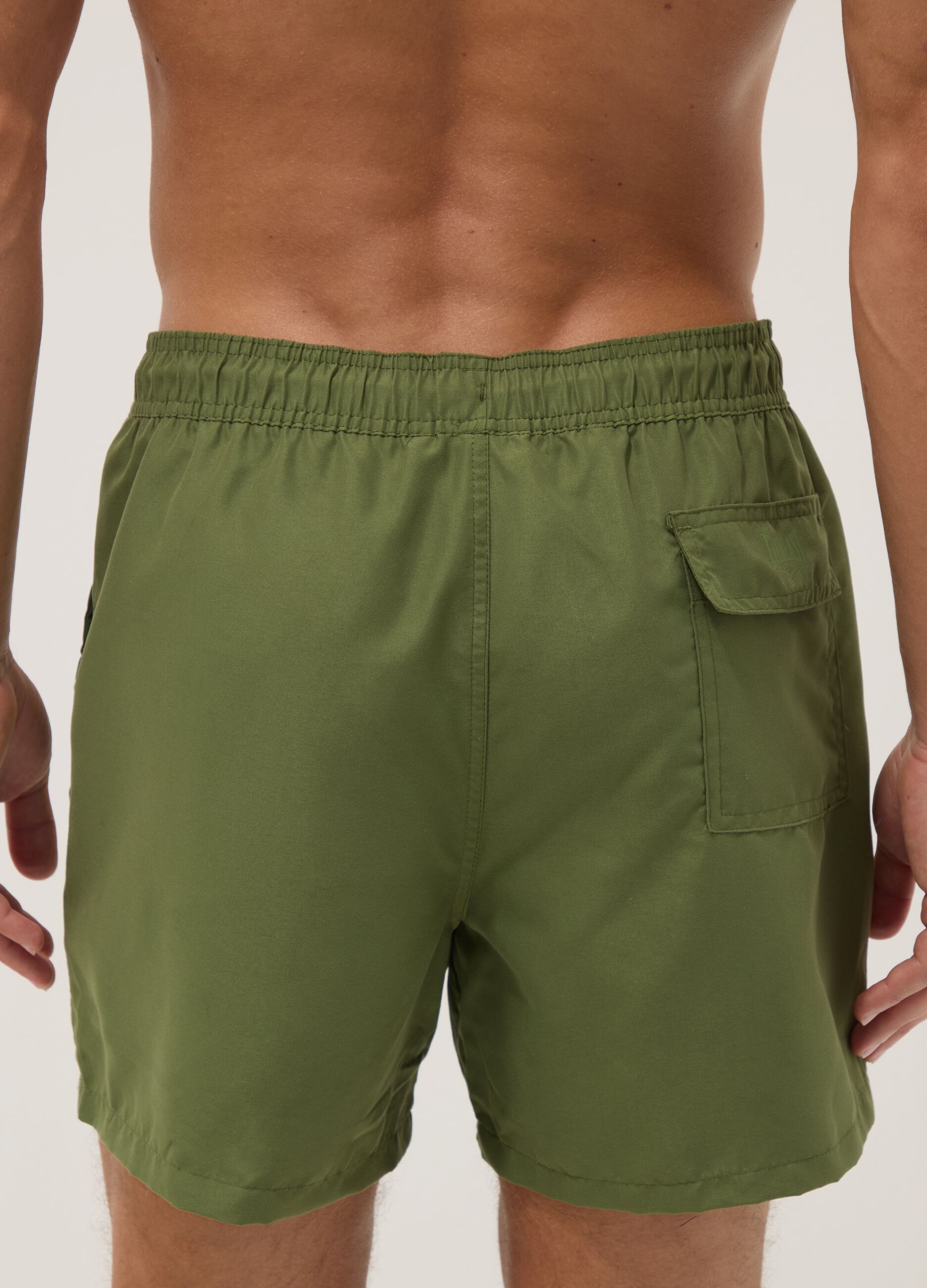 Green swim shorts with contrast drawstring