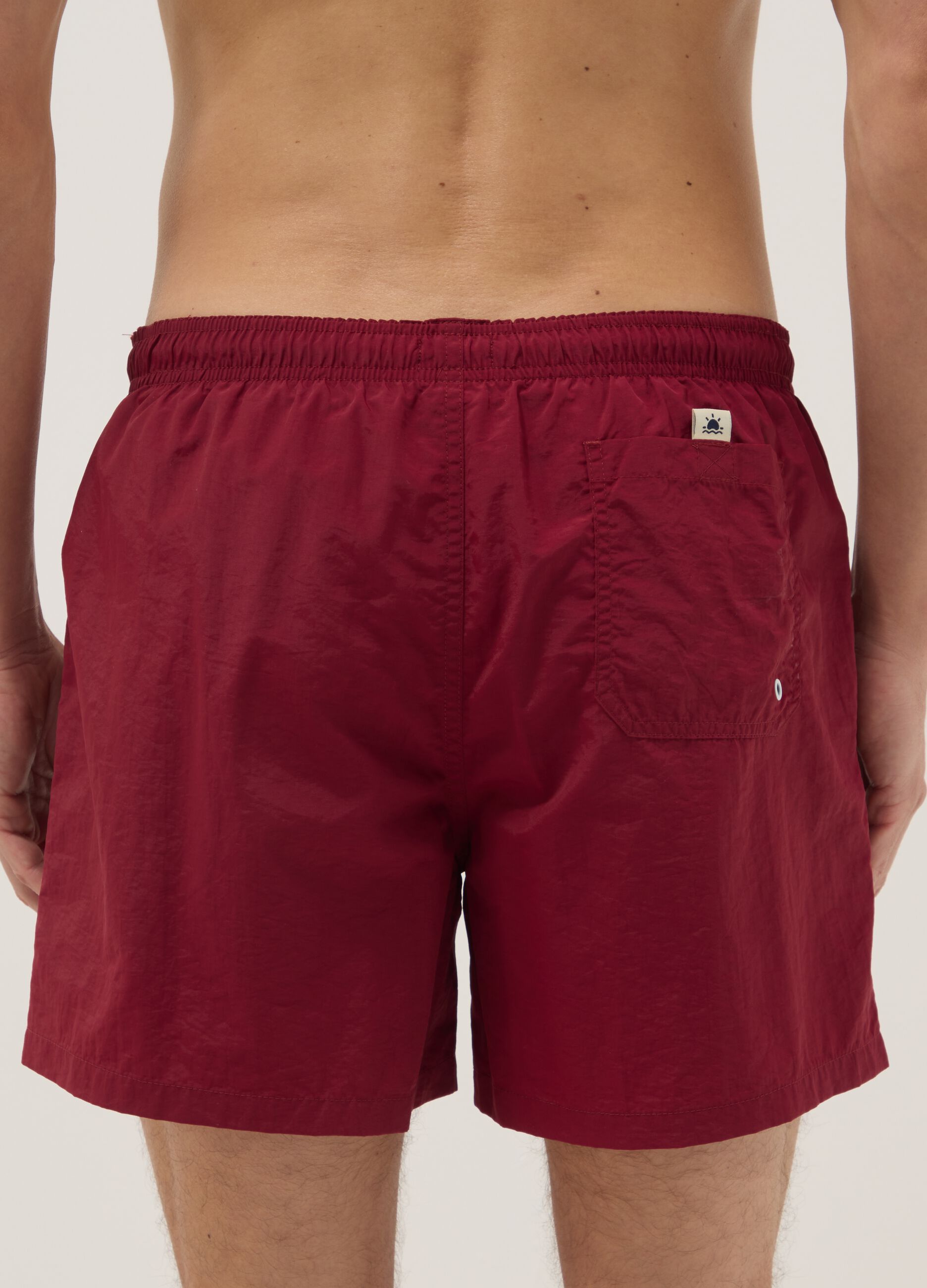 Red regular-fit swim shorts with drawstring