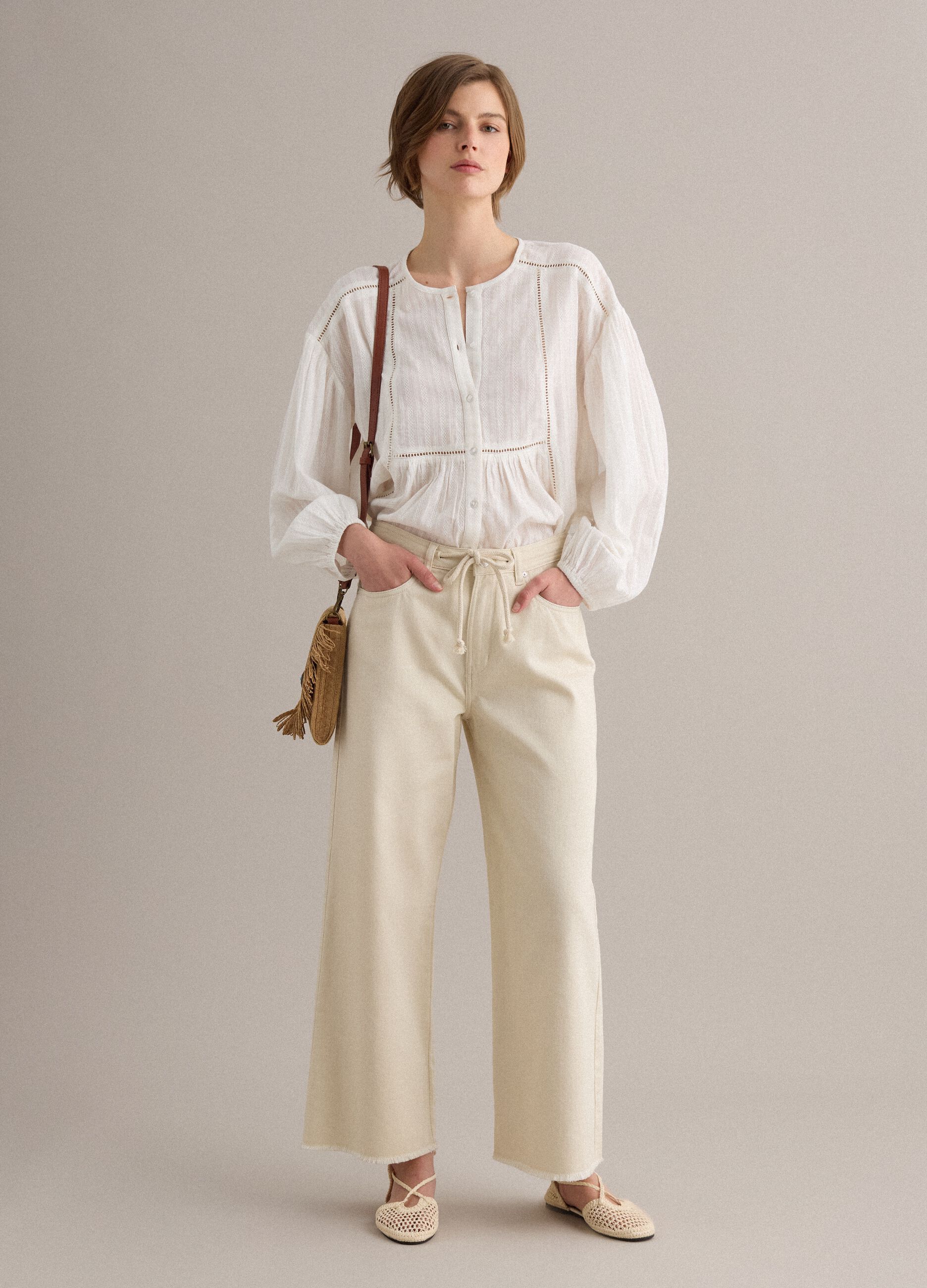 Bolso bandolera beige en tejido mezcla de papel con flecos