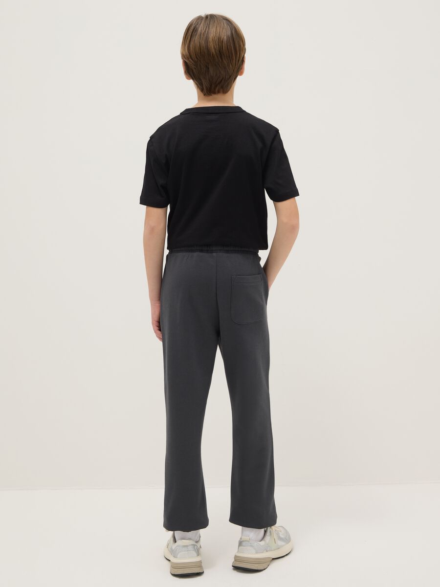 Regular fit black cotton jogger trousers for boys_1