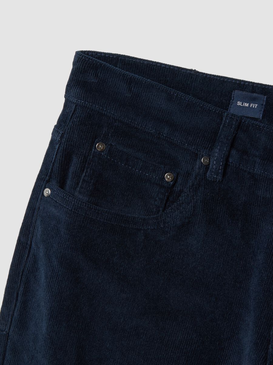 Pantaloni blu in cotone elasticizzato a coste slim fit_1
