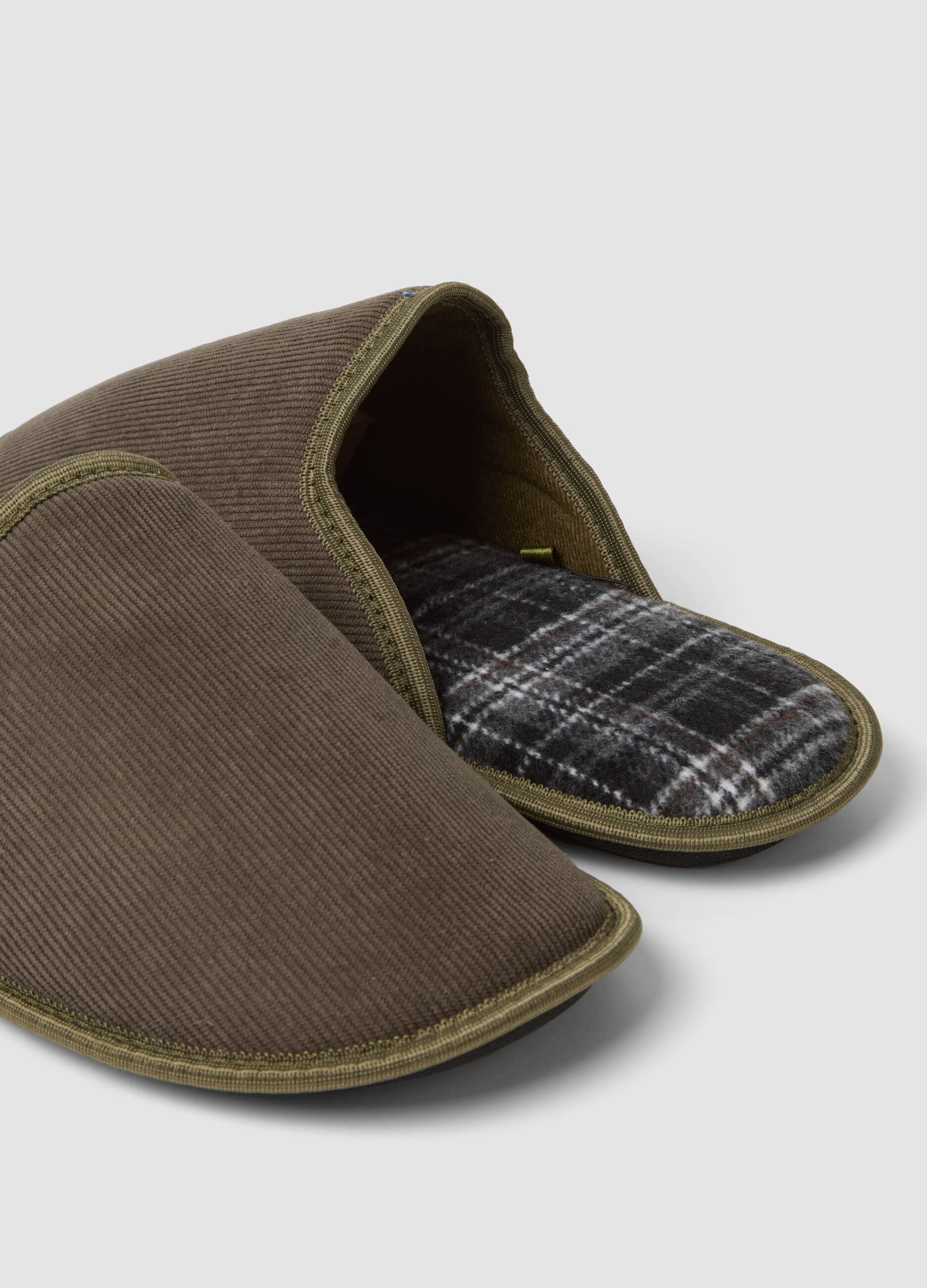 Brown slip-on house slippers with checked lining