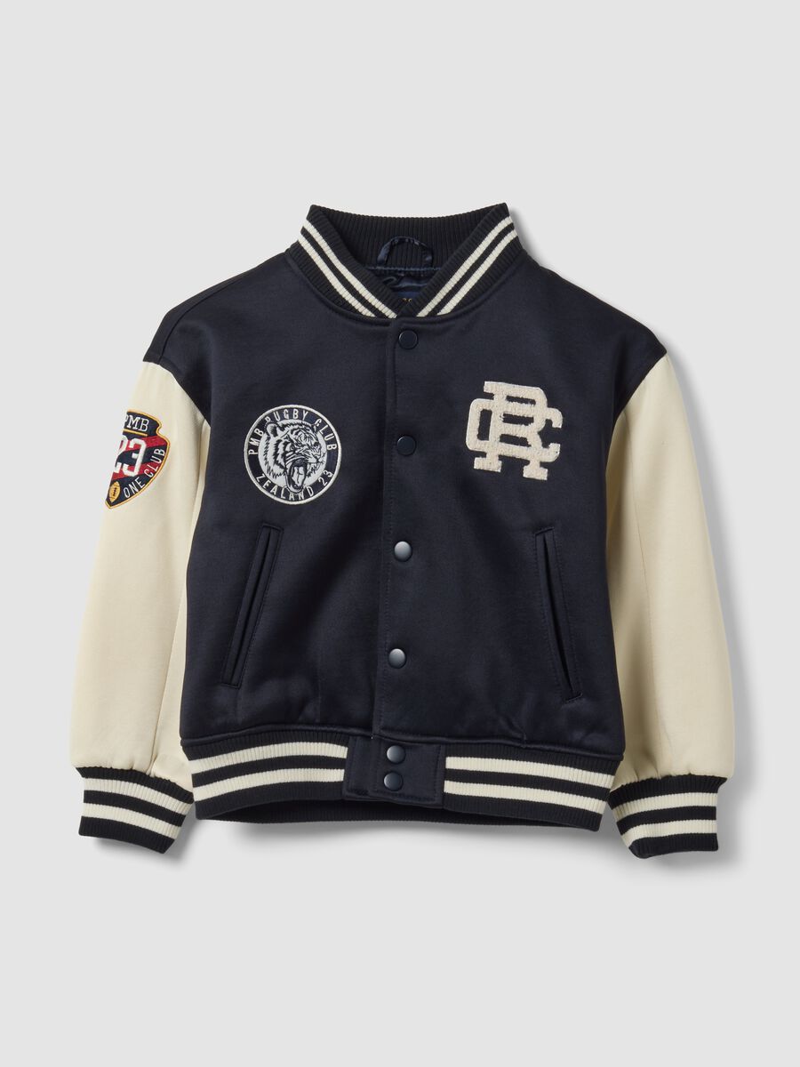 Blue varsity jacket with beige sleeves and print for boys_0