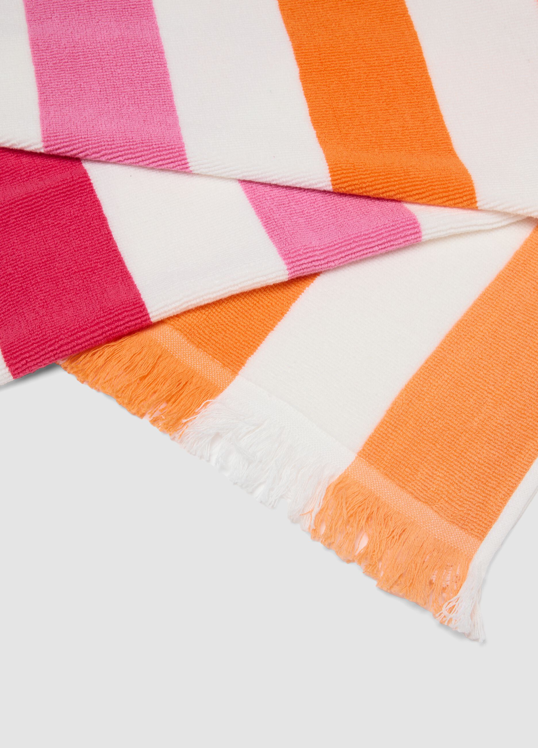 Telo mare multicolor in puro cotone a righe e con frange