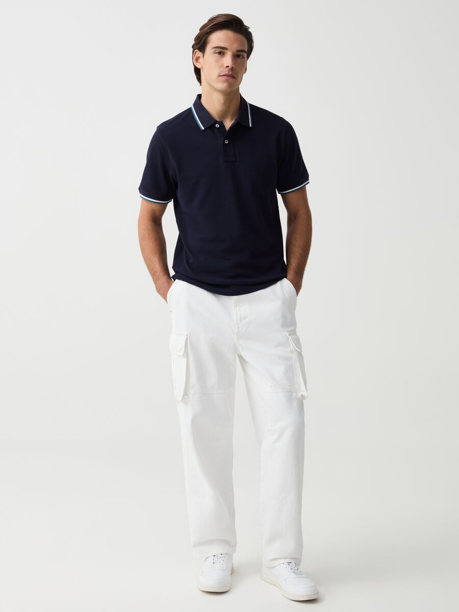 Polo shirt in piquet with striped edging_1