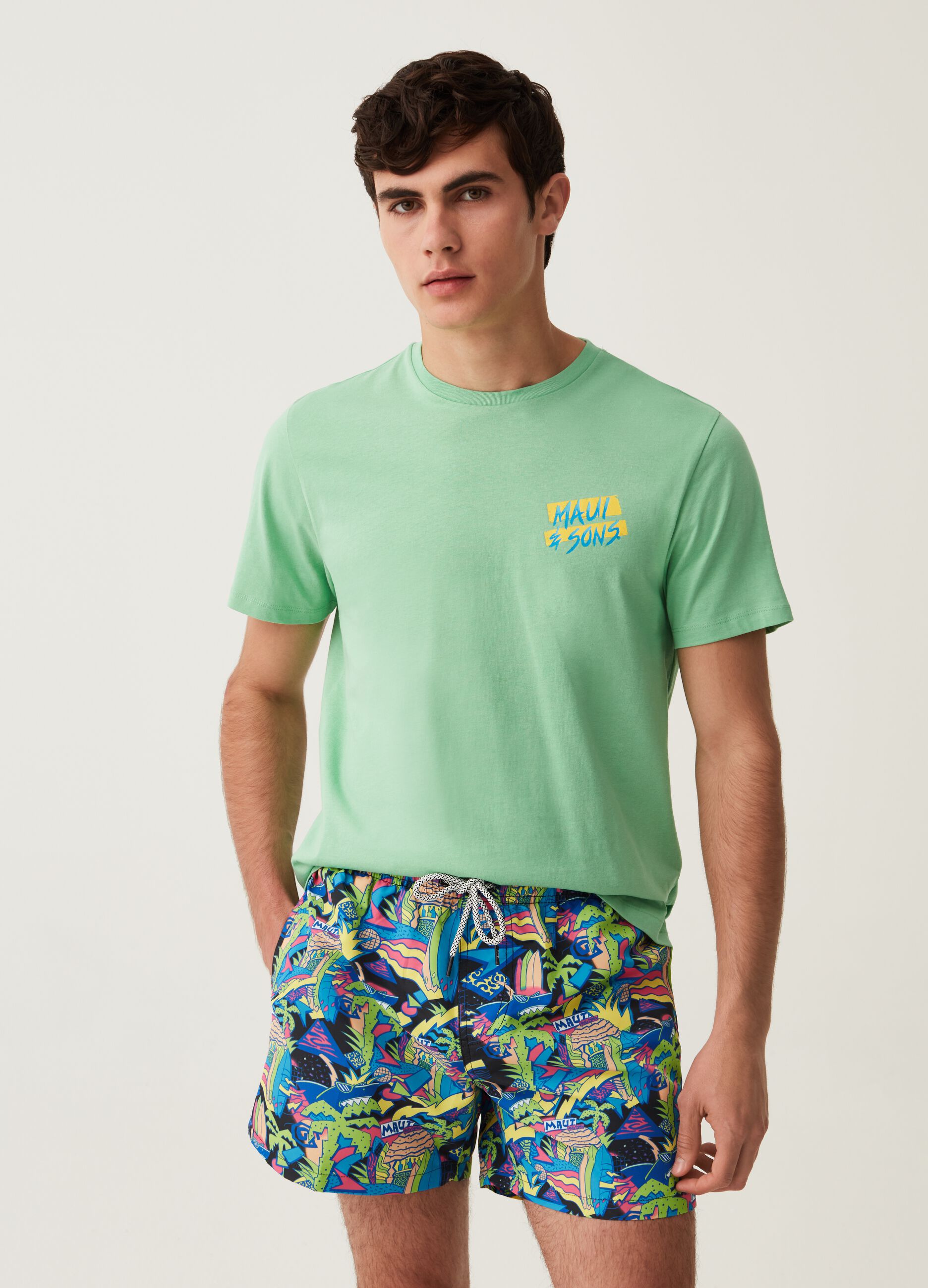 Maui and Sons swimming trunks with tropical print