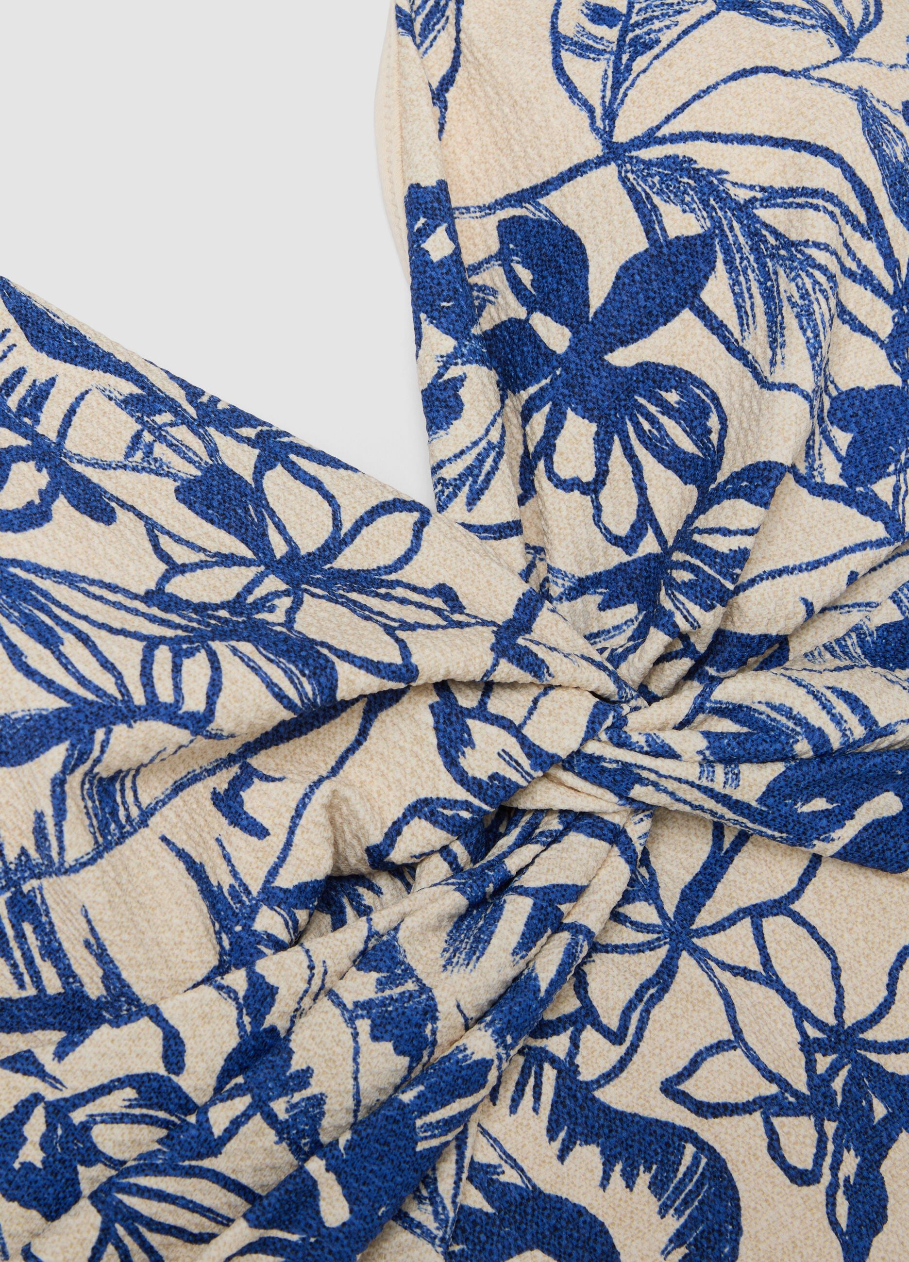 Blauer, elastischer Badeanzug mit Blumenprint