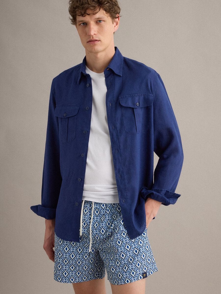 Blue swim shorts with geometric print_1