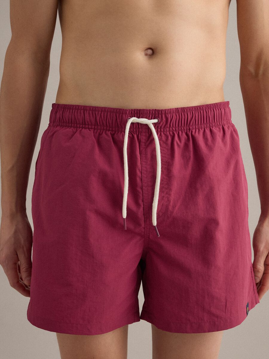 Red swim shorts with elasticated waistband and drawstring_2