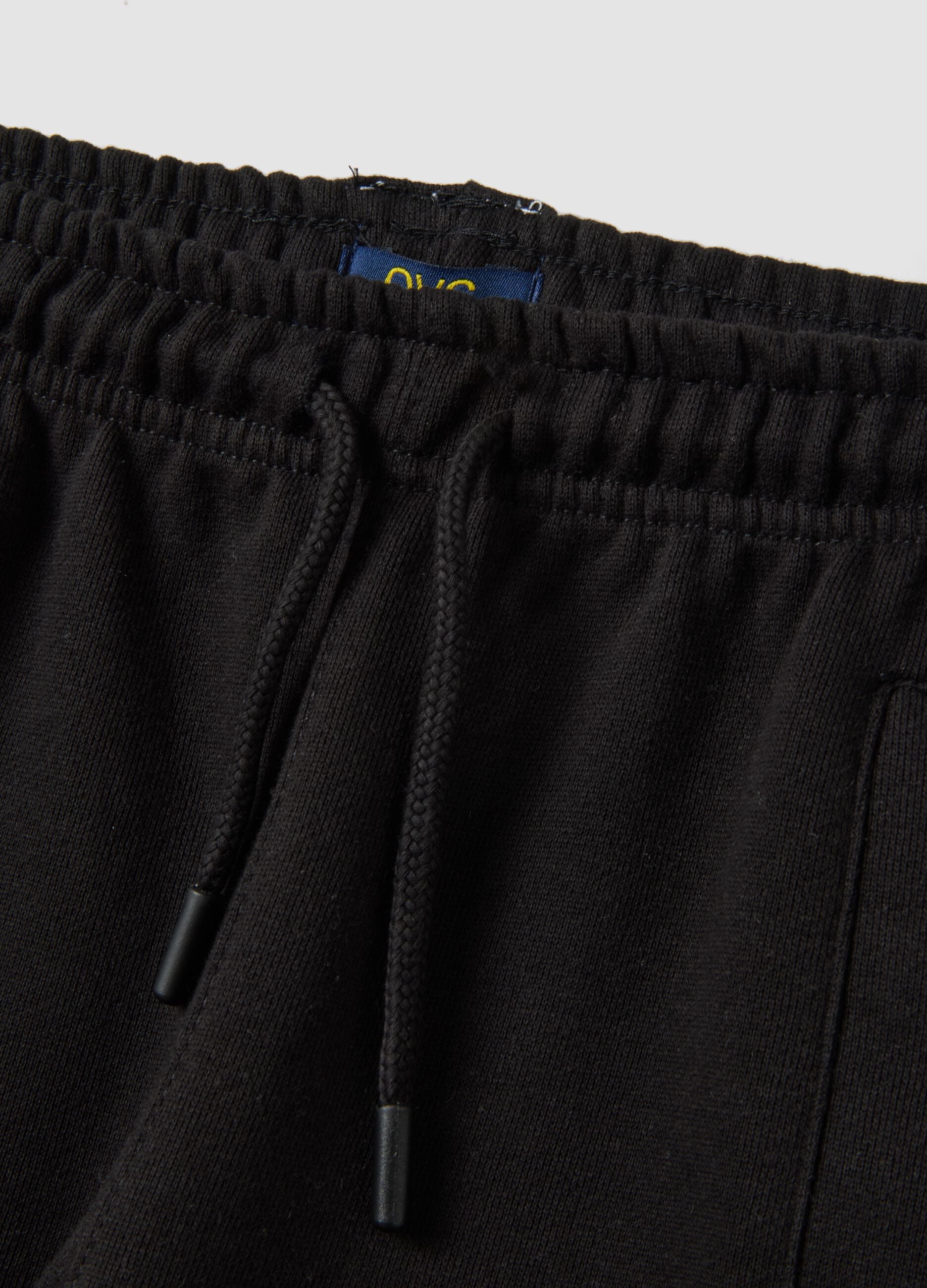 Black cotton-blend joggers with ankle zips