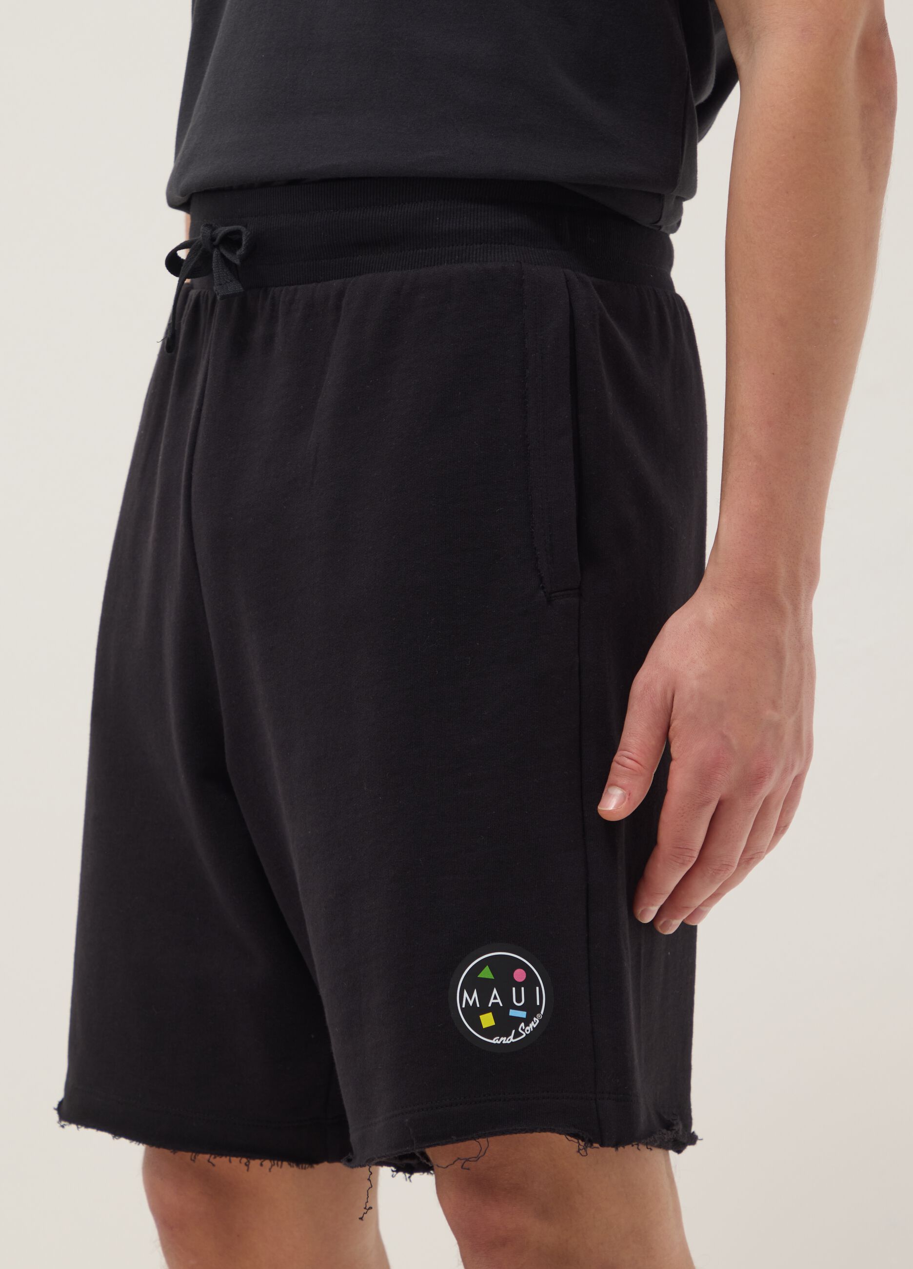 Black pure cotton relaxed-fit Bermuda shorts with raw-cut hems