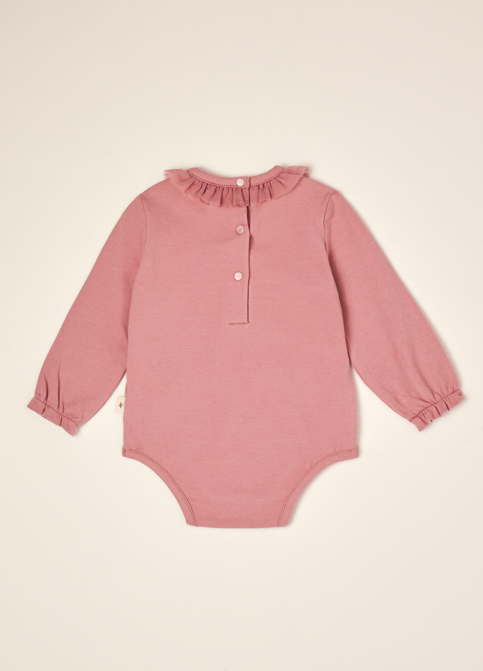 Pink organic stretch cotton bodysuit with ruffled crew neck