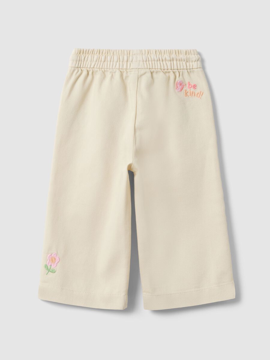 Beige wide-leg pure cotton trousers for baby girls with embroidered detailing_1