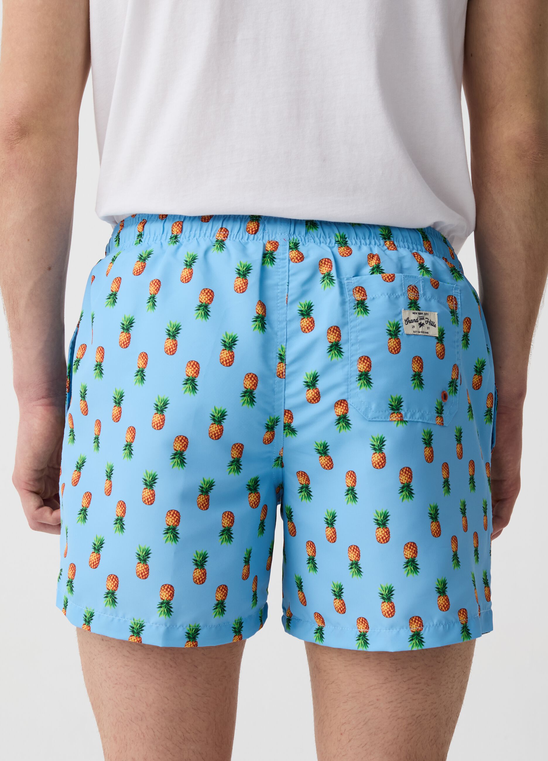 Swimming trunks with mini pineapples print
