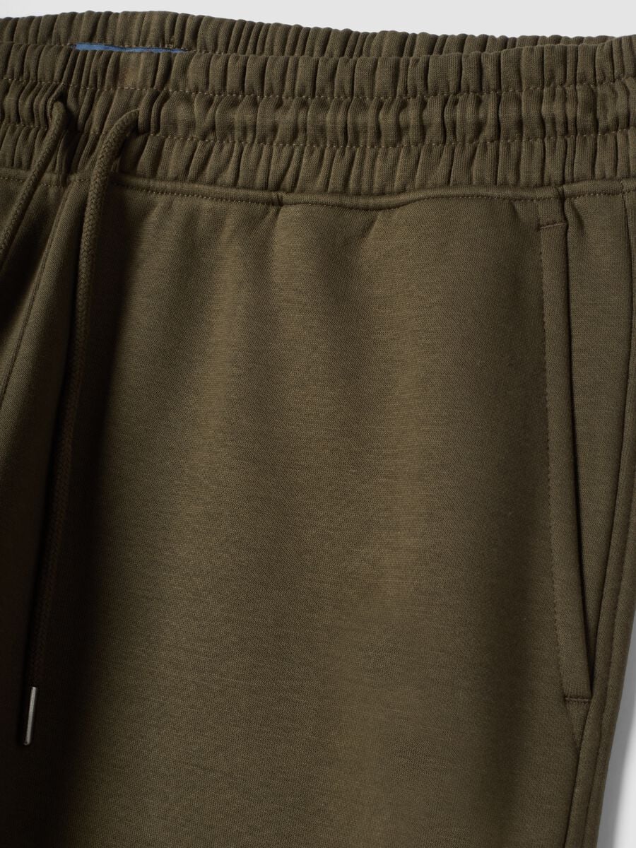 Jogger verdi in misto cotone con fondo a polsino e coulisse_1