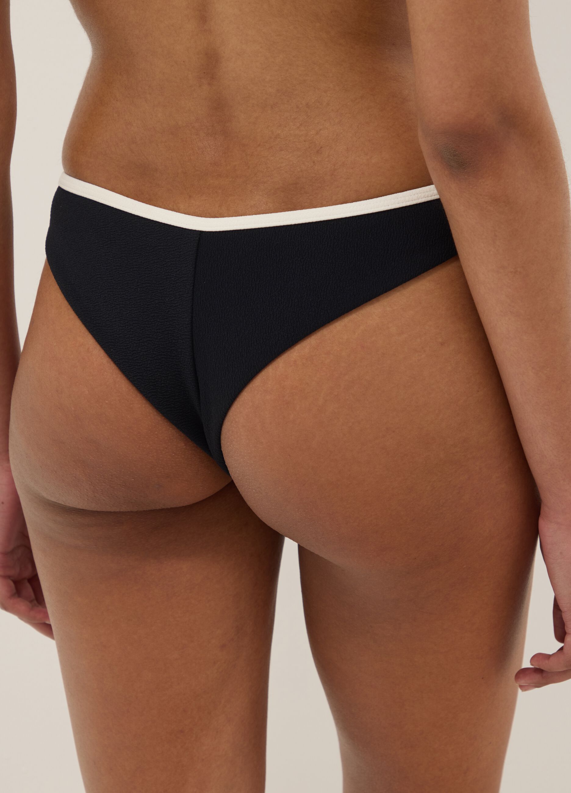 Black stretch swim briefs with white trim