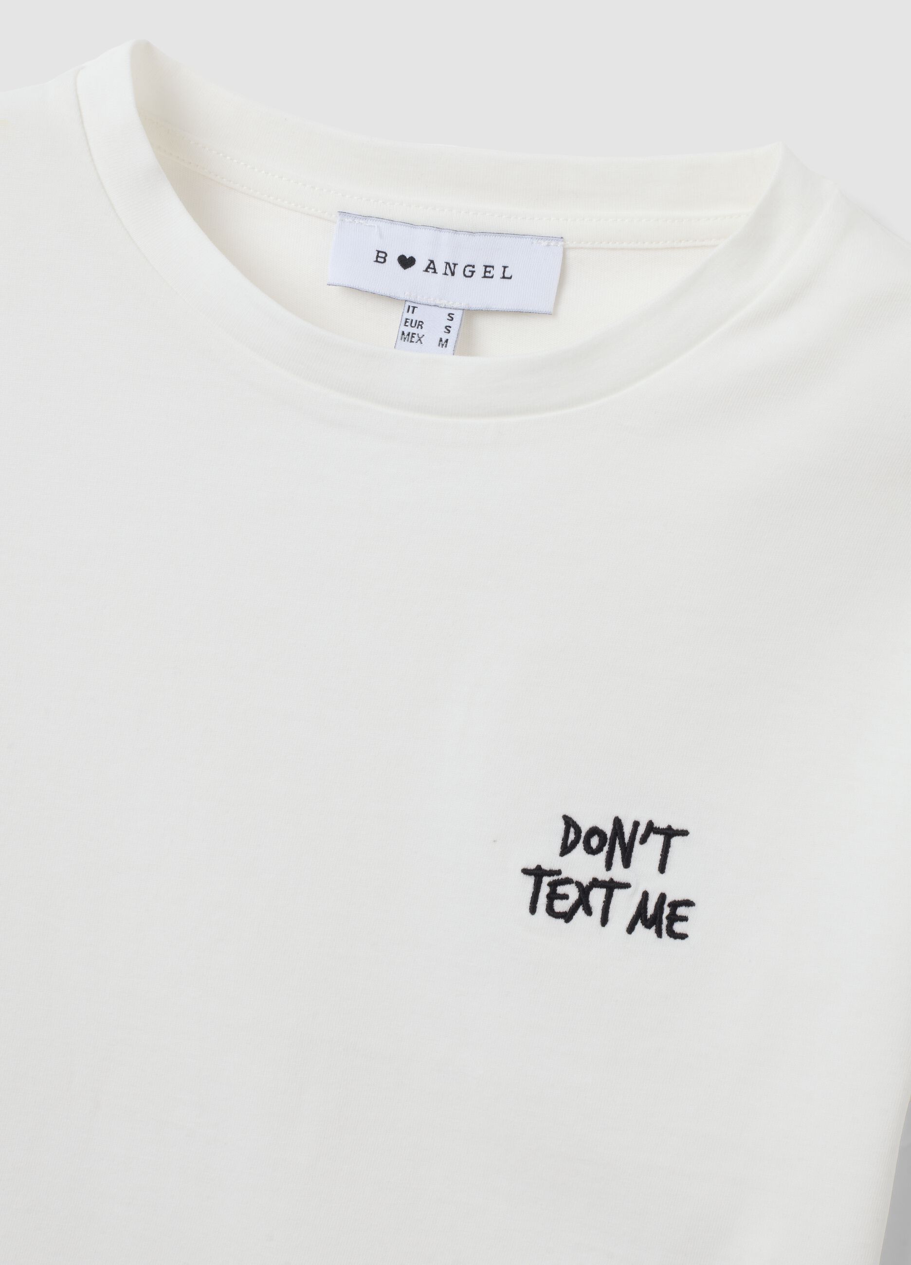 T-shirt crop bianca in puro cotone con stampa grafica regular fit
