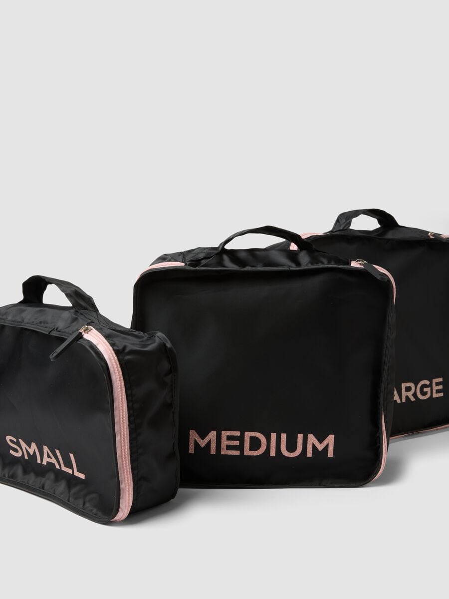 Set di tre organizer neri da viaggio con zip rosa_1