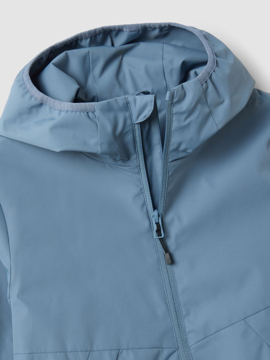 Blue oversized rain jacket with hood and zip for boys_2
