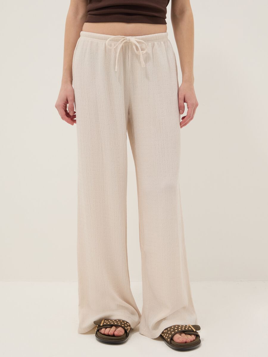 Beige wide leg jogger trousers_1